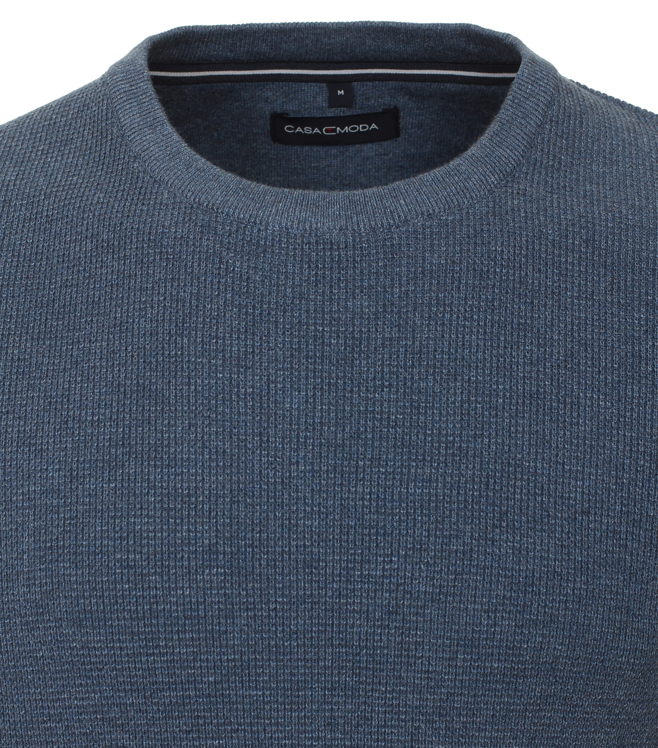 Ein Pullover im uni Muster in der Farbe Grünblau
