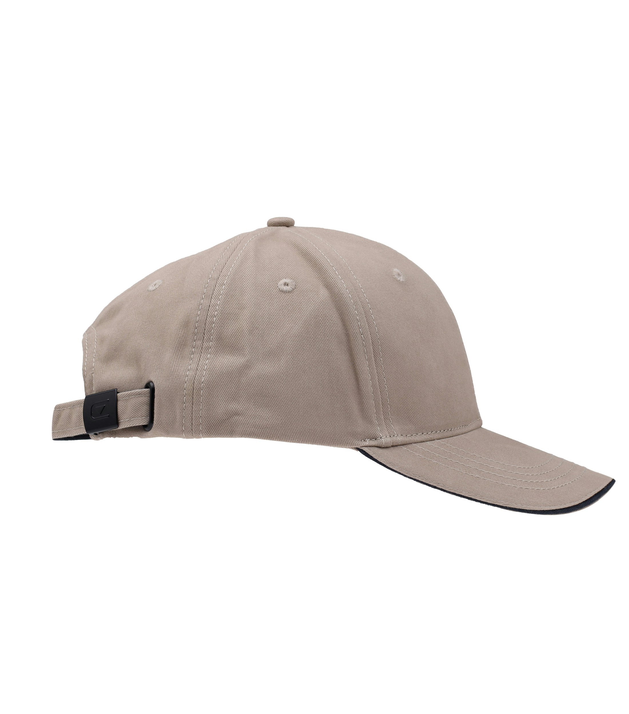 Ein Cap im uni Muster in der Farbe Beige