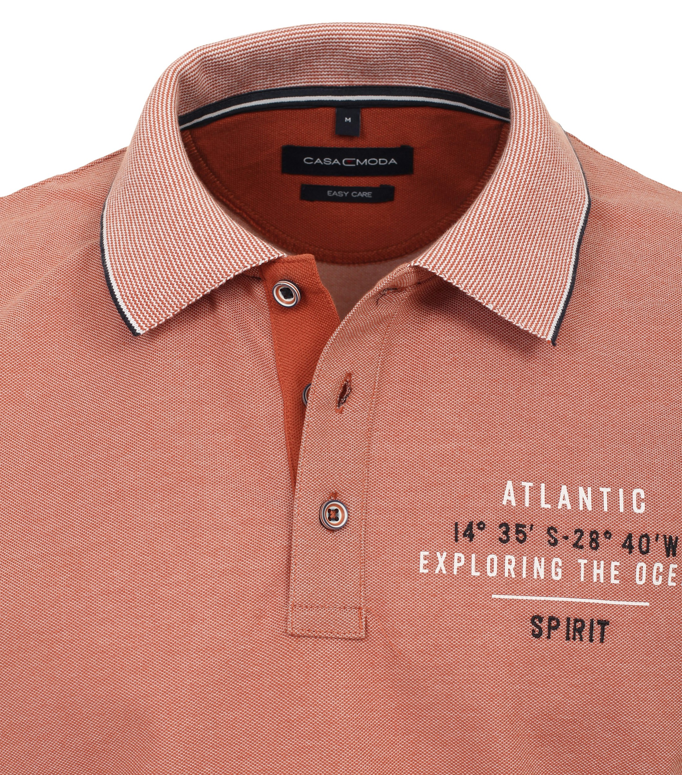 Ein Polo-Shirt im uni Muster in der Farbe Orange
