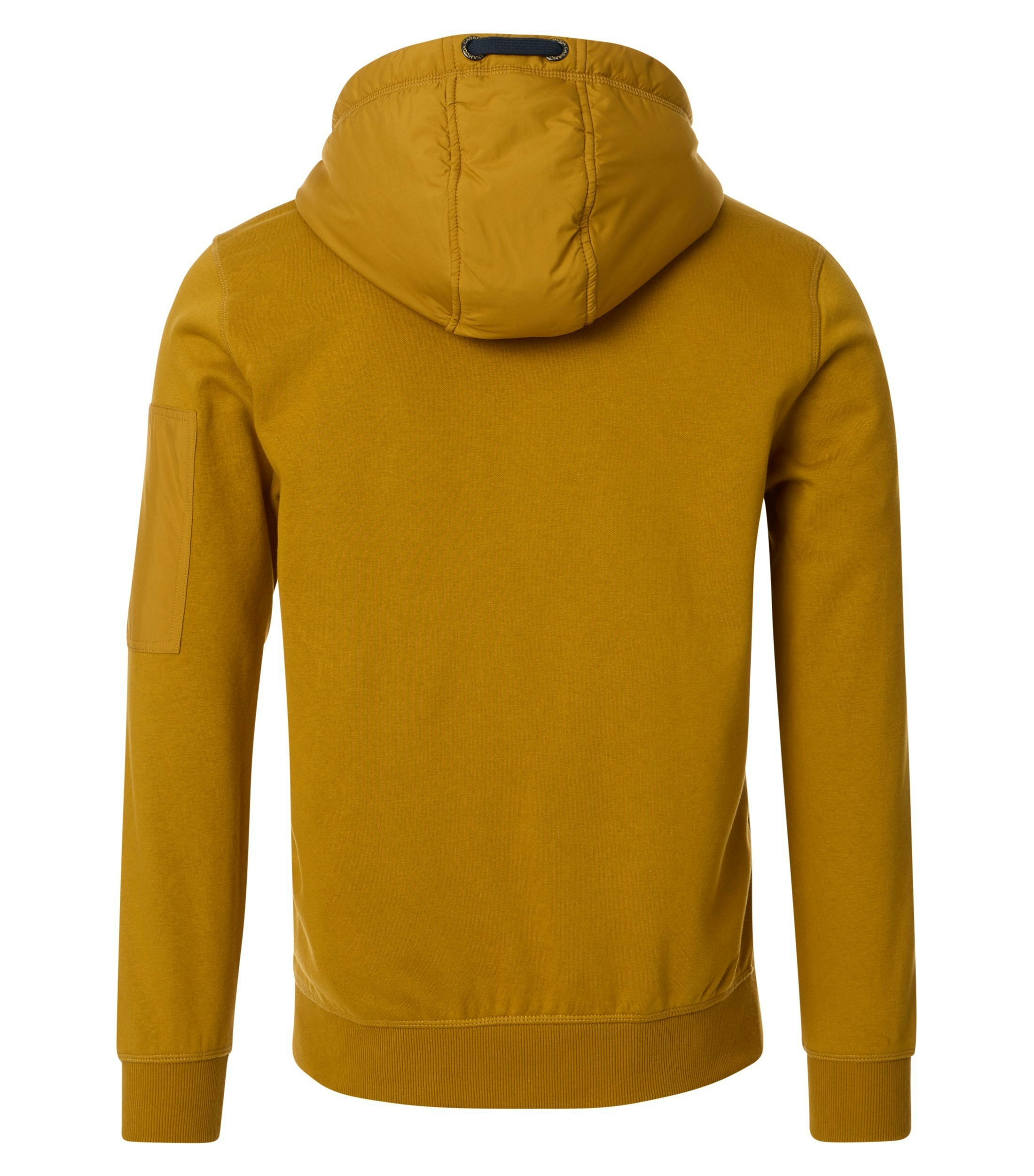 Das Model trägt ein Sweatshirt im uni Muster in der Farbe Senfgelb