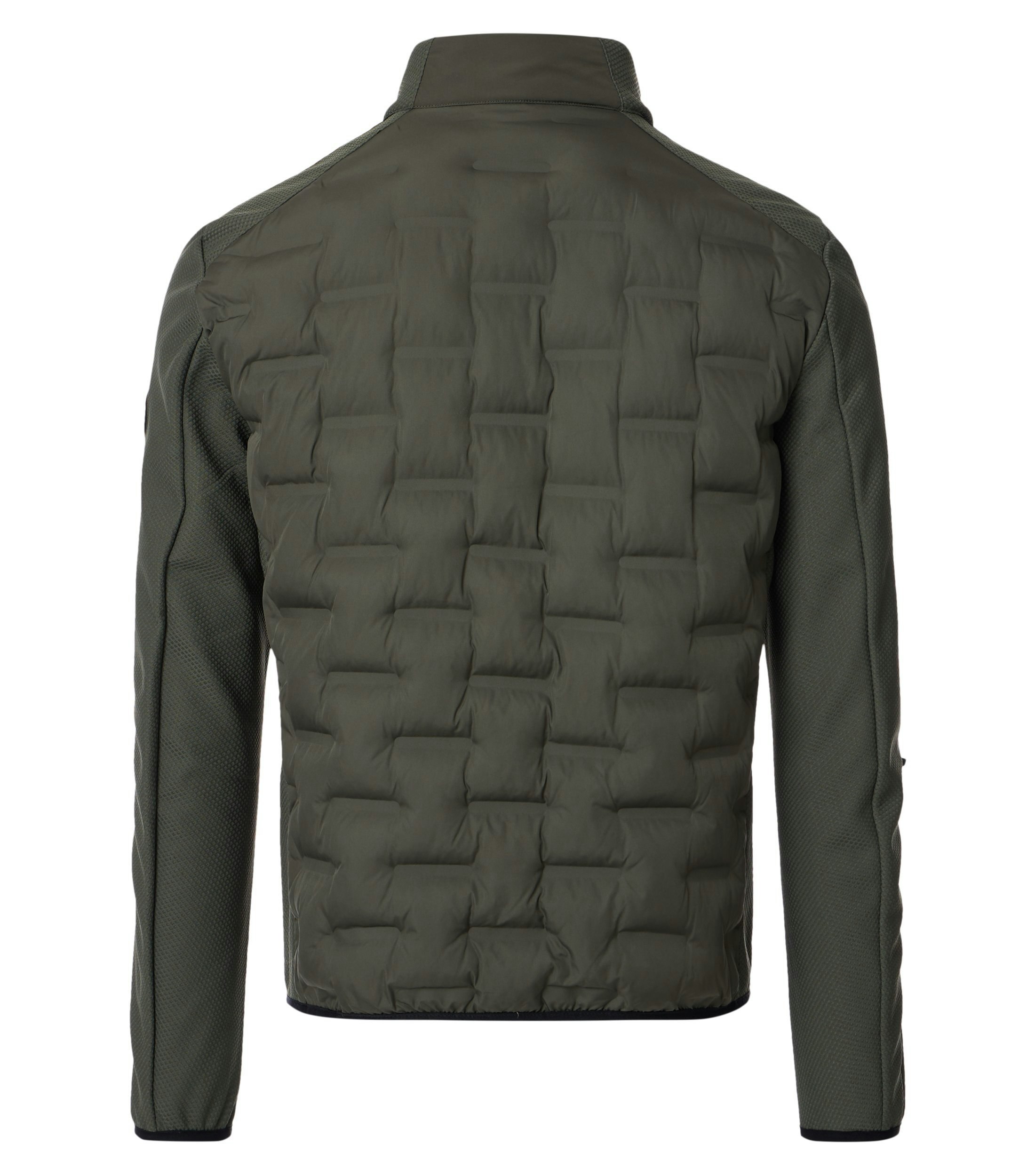 Das Model trägt eine Jacke im uni Muster in der Farbe Grün