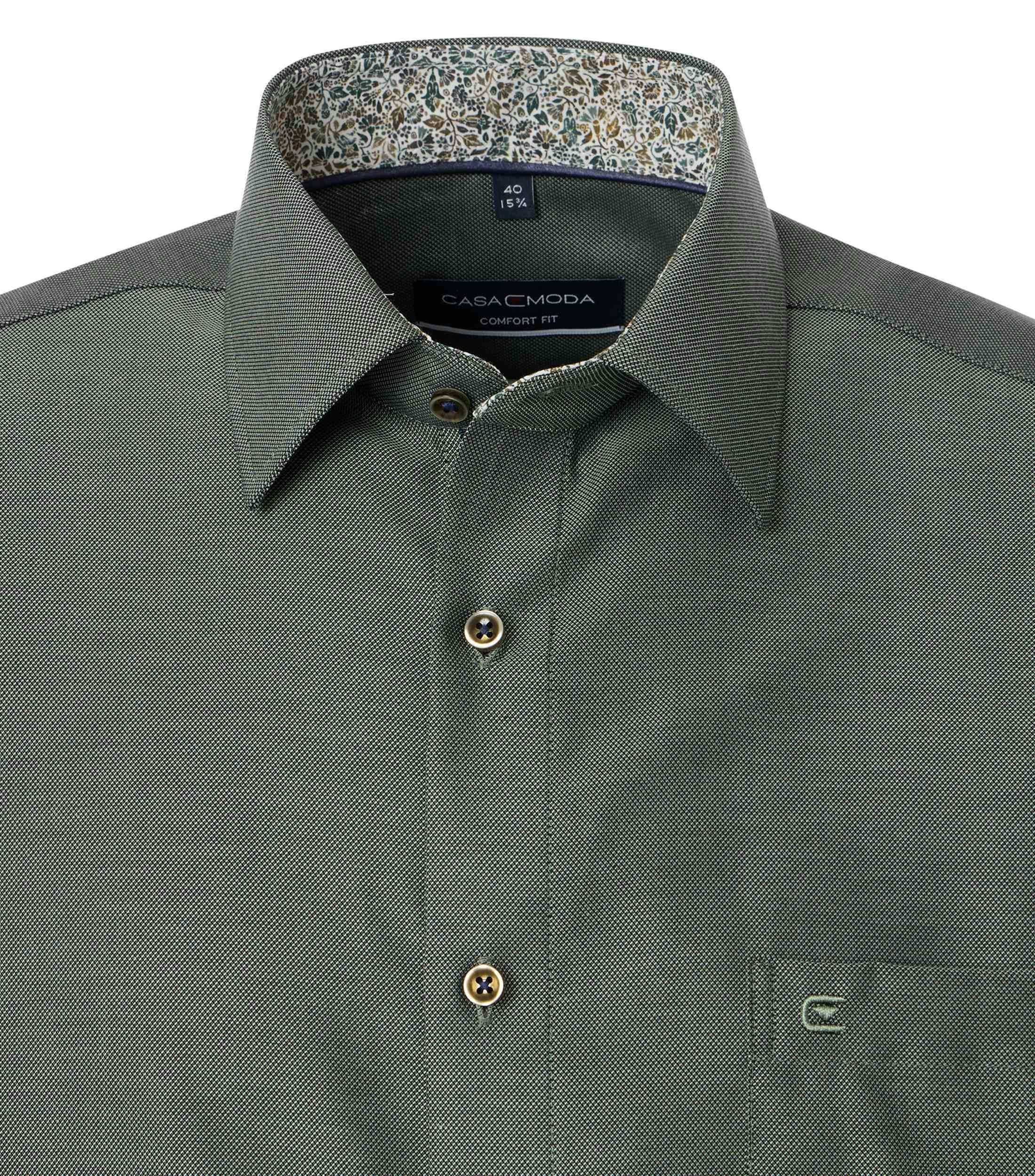 Ein Businesshemd im uni Muster in der Farbe Dunkelgrün