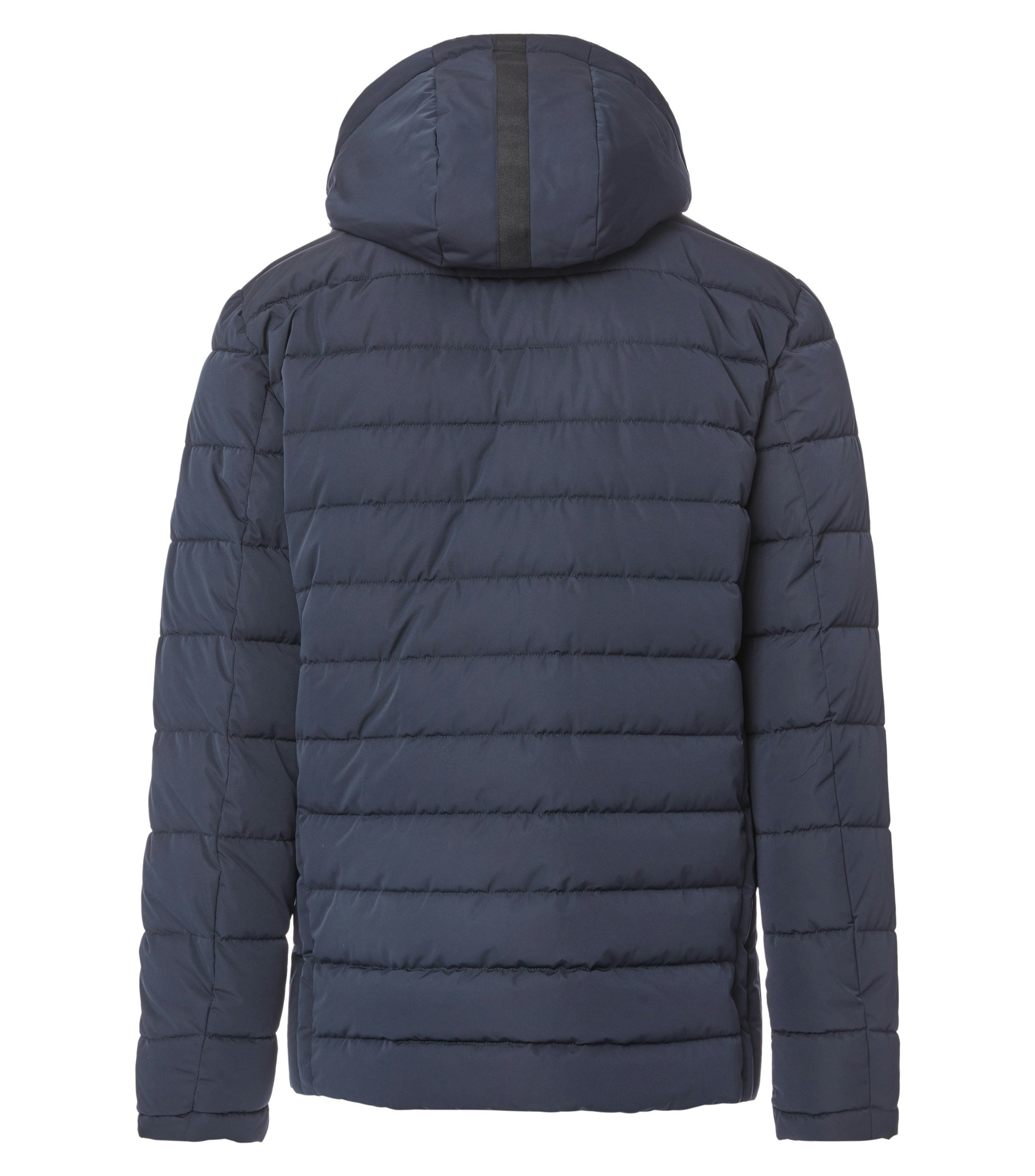 Das Model trägt eine Jacke im uni Muster in der Farbe Blau