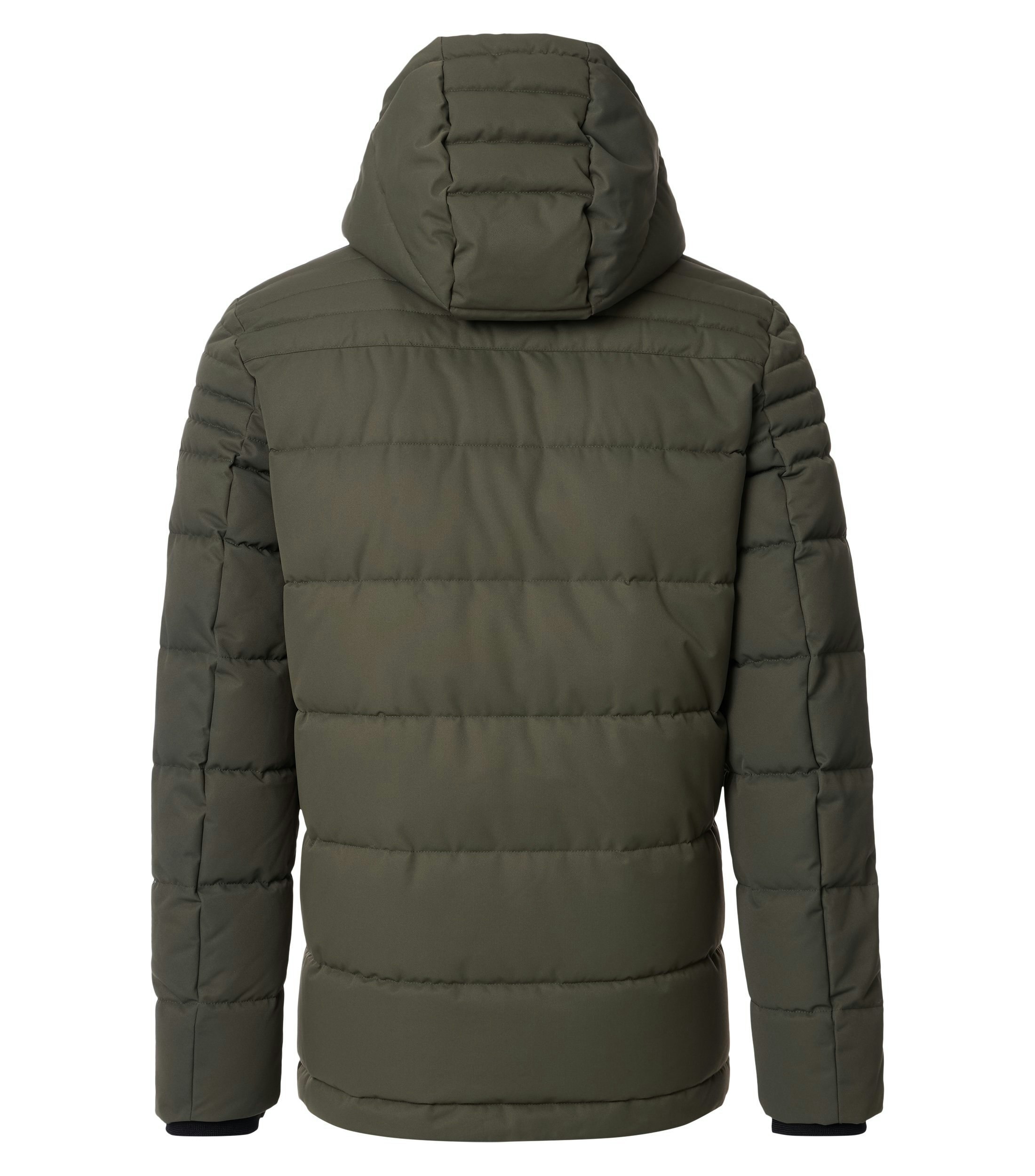 Das Model trägt eine Jacke im uni Muster in der Farbe Grün