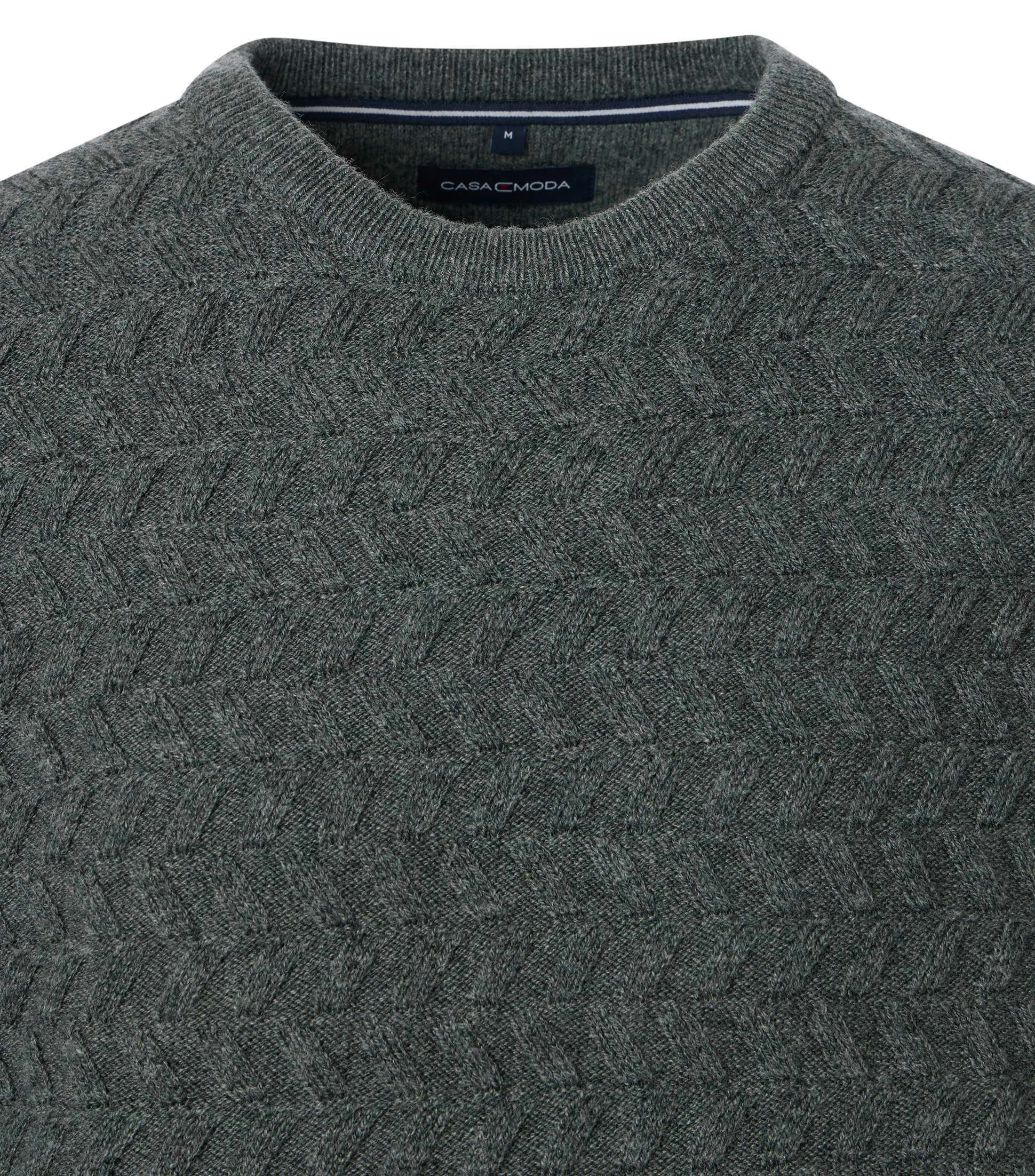 Ein Pullover im uni Muster in der Farbe Grün