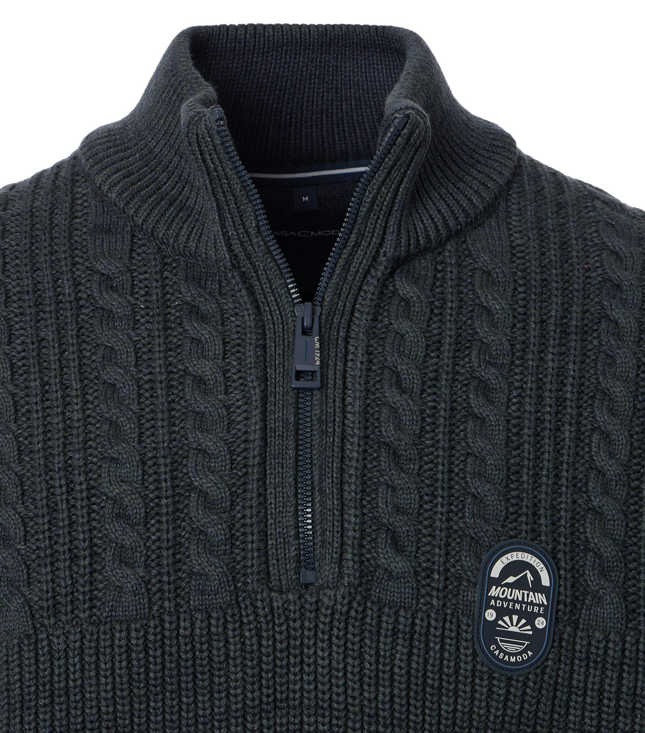 Ein Pullover im uni Muster in der Farbe Grün