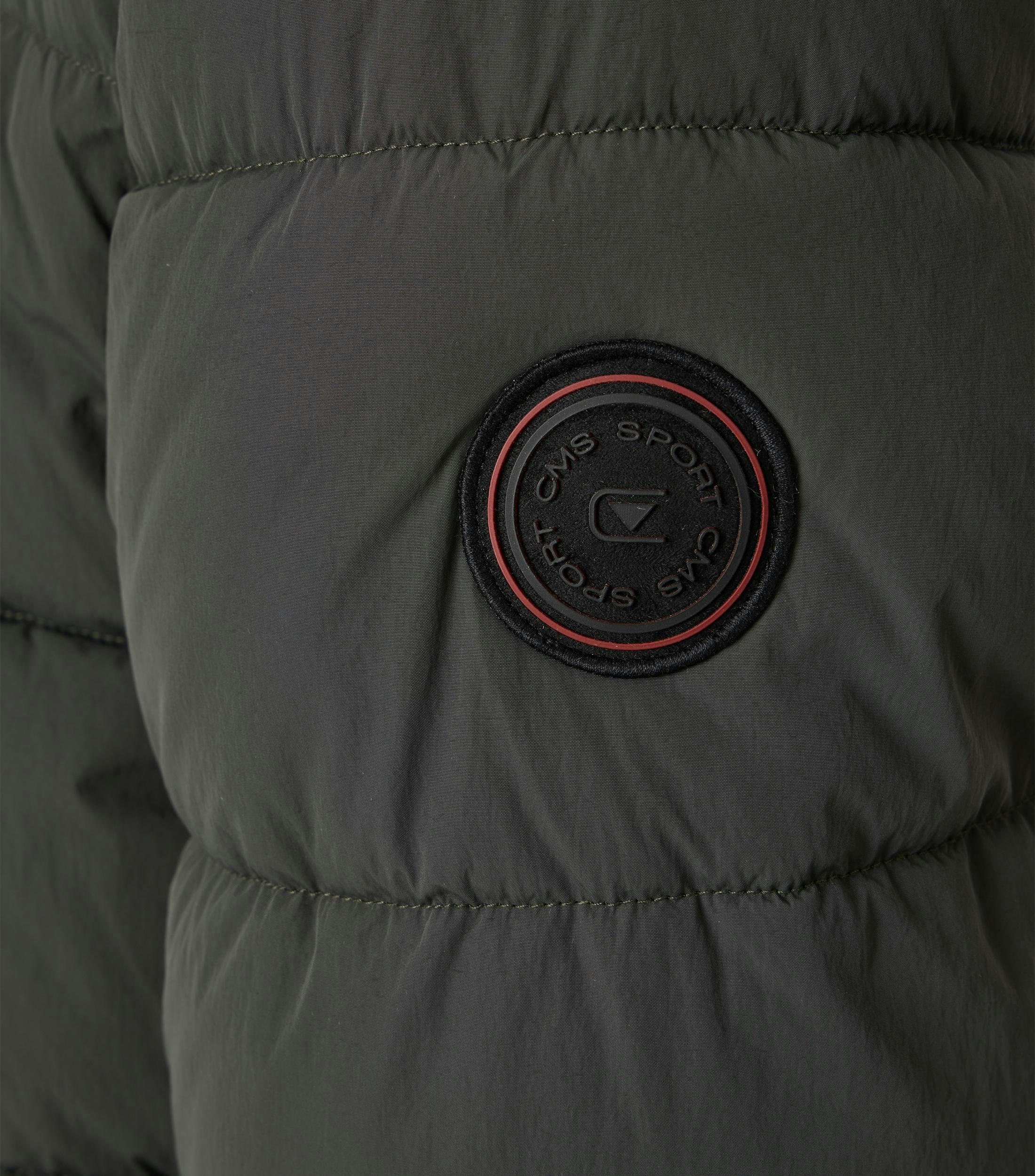 Ein Jacke im uni Muster in der Farbe Dunkelgrün