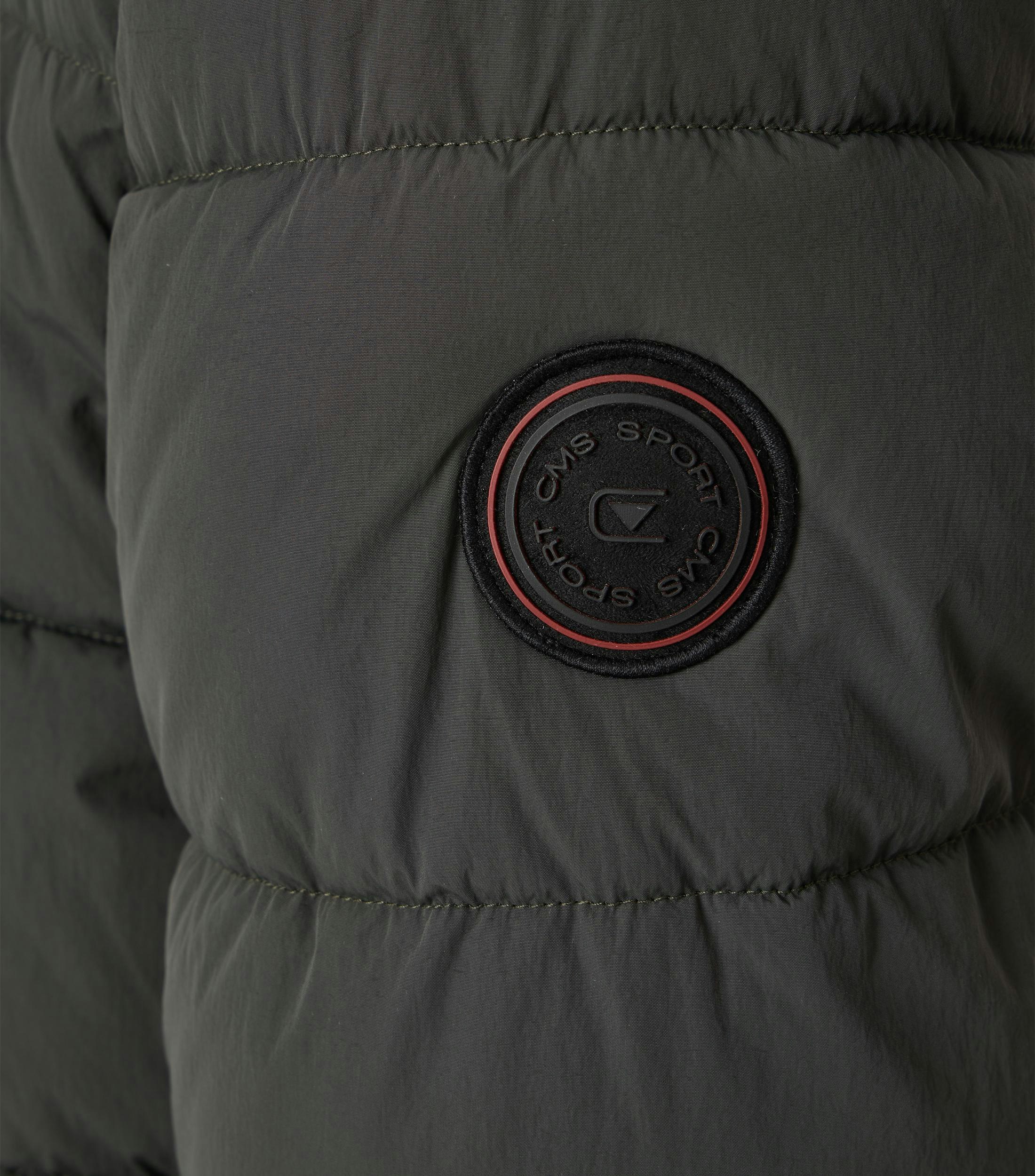 Ein Jacke im uni Muster in der Farbe Dunkelgrün