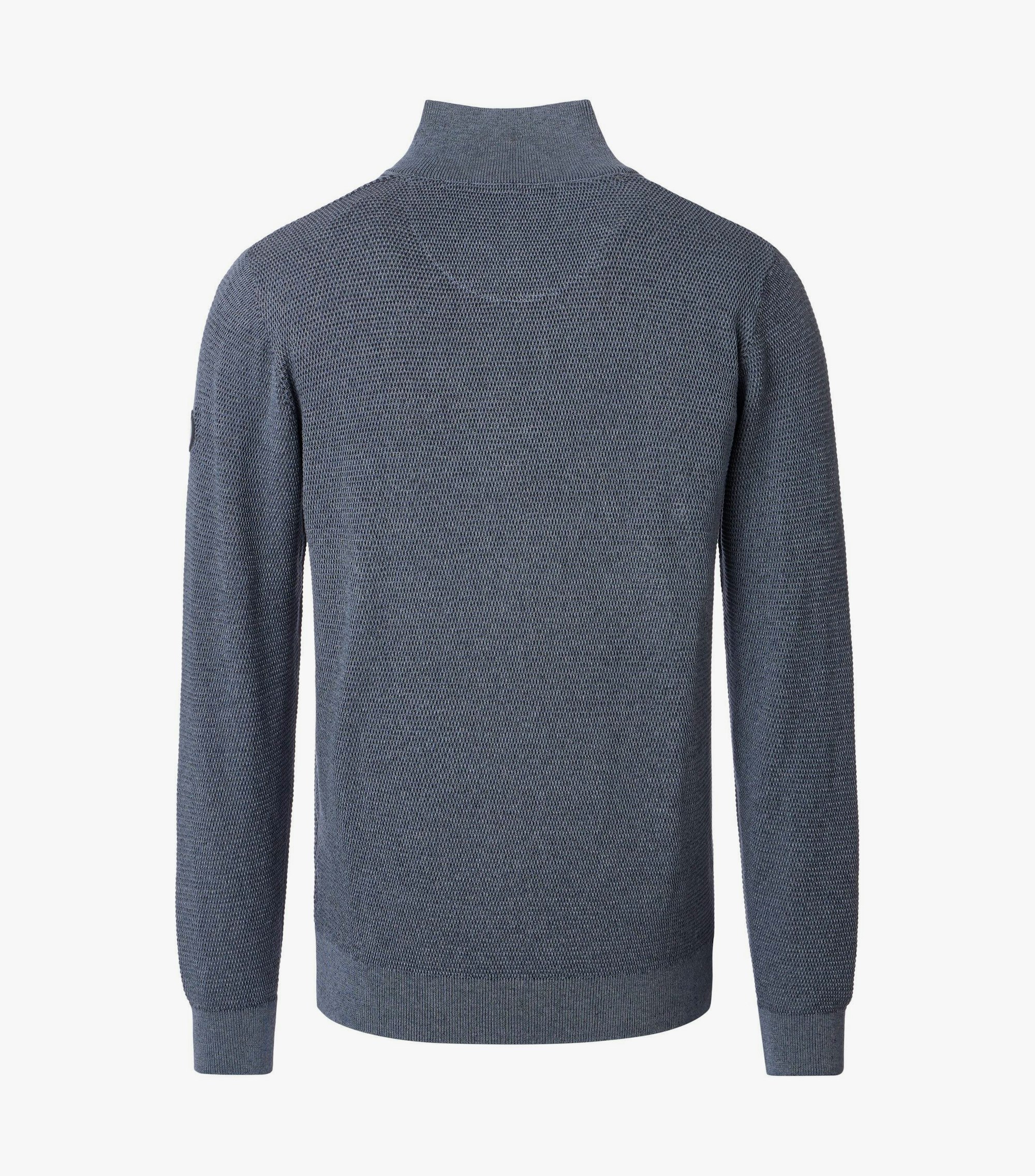 Das Model trägt ein Pullover im uni Muster in der Farbe Grau