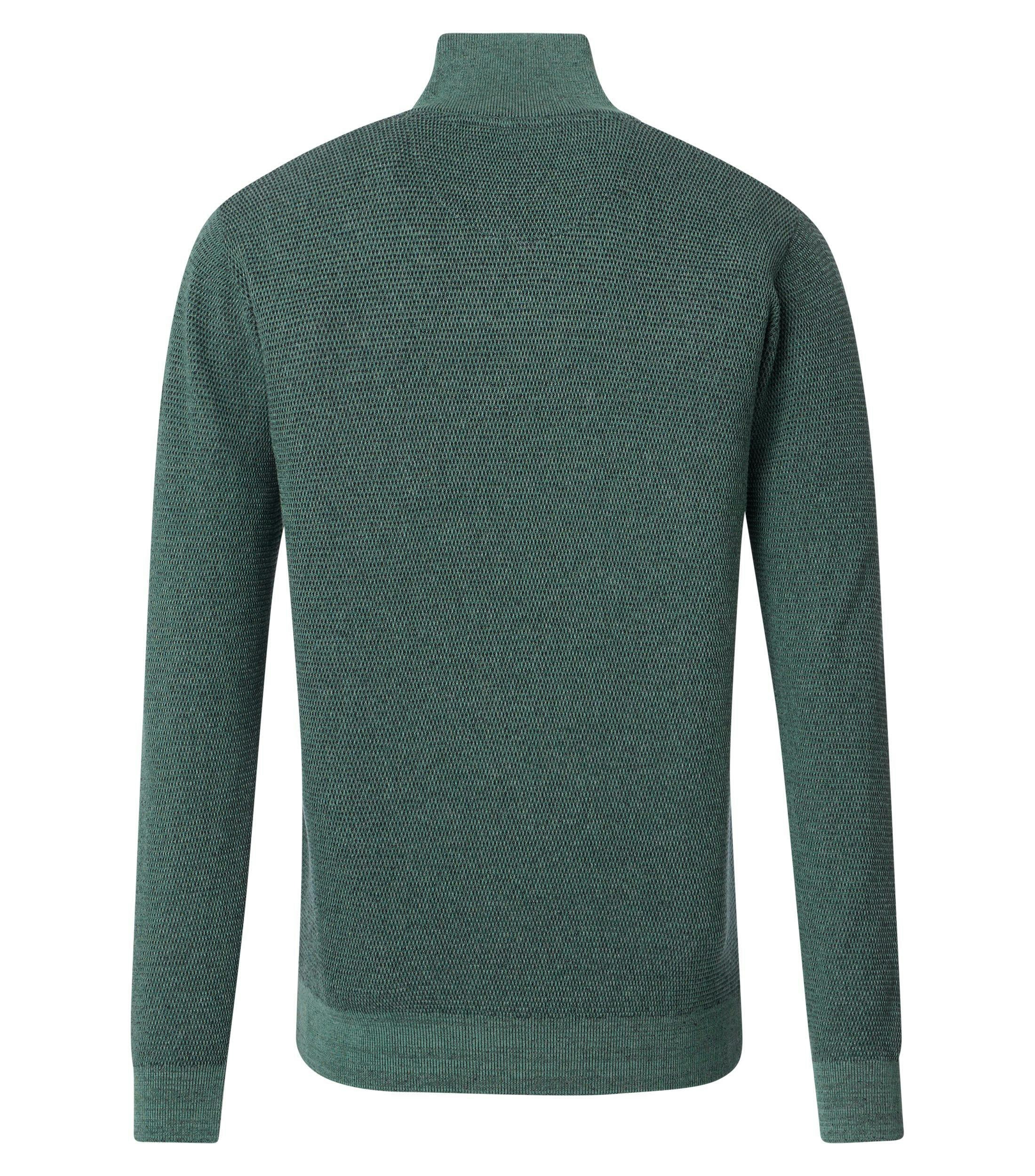 Das Model trägt ein Pullover im uni Muster in der Farbe Türkisgrün