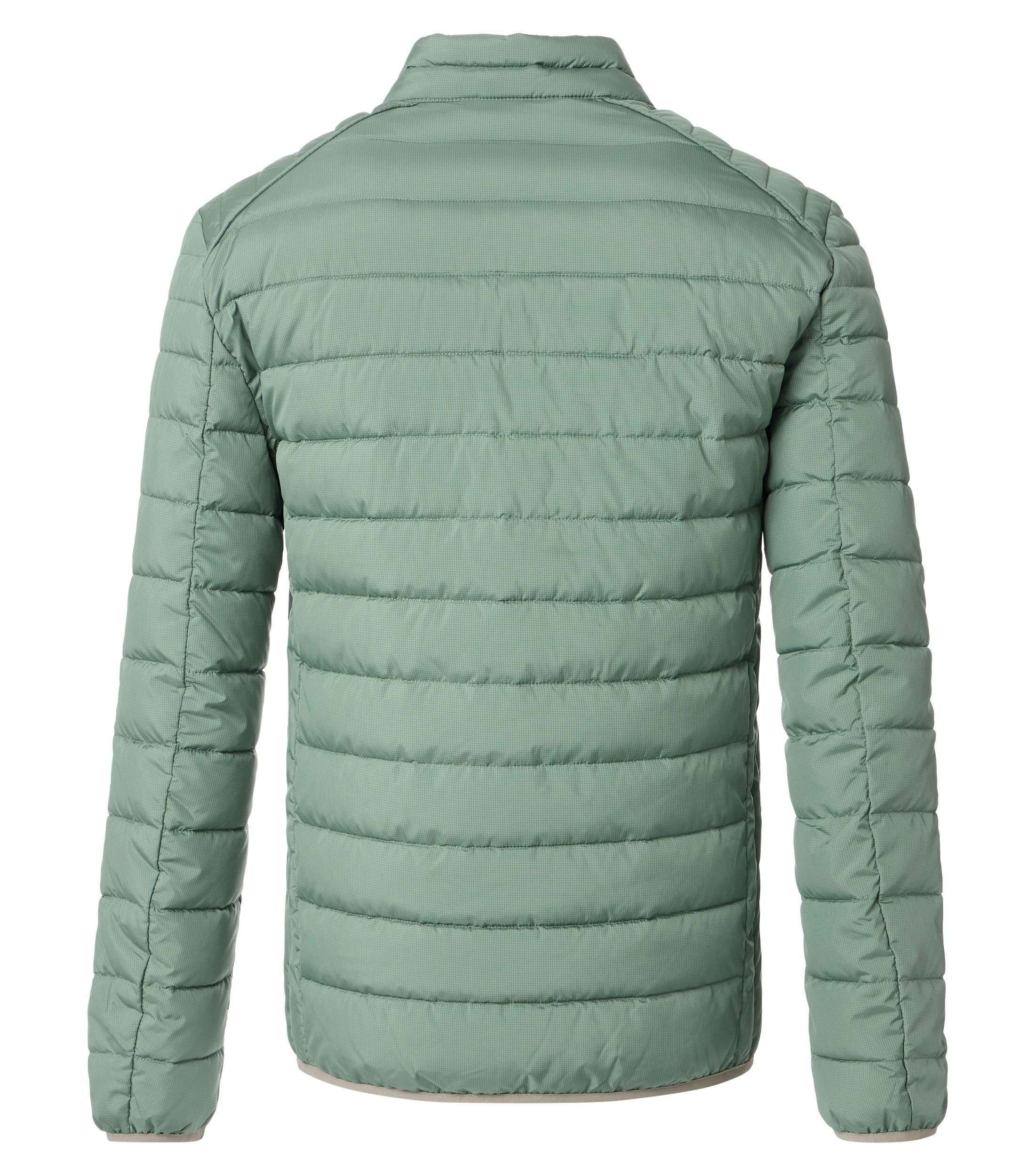 Das Model trägt eine Jacke im uni Muster in der Farbe Mint