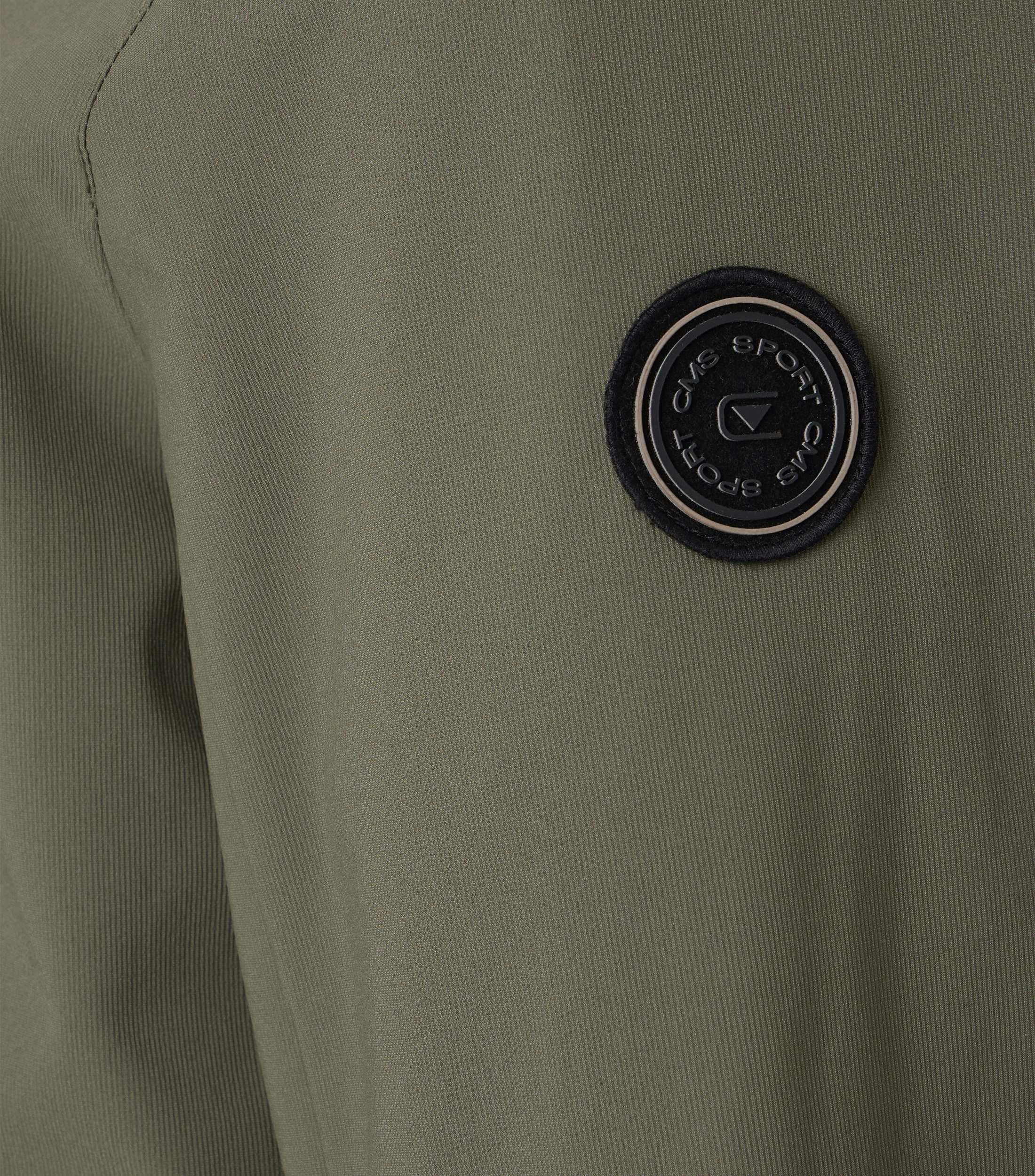 Ein Jacke im uni Muster in der Farbe Grün