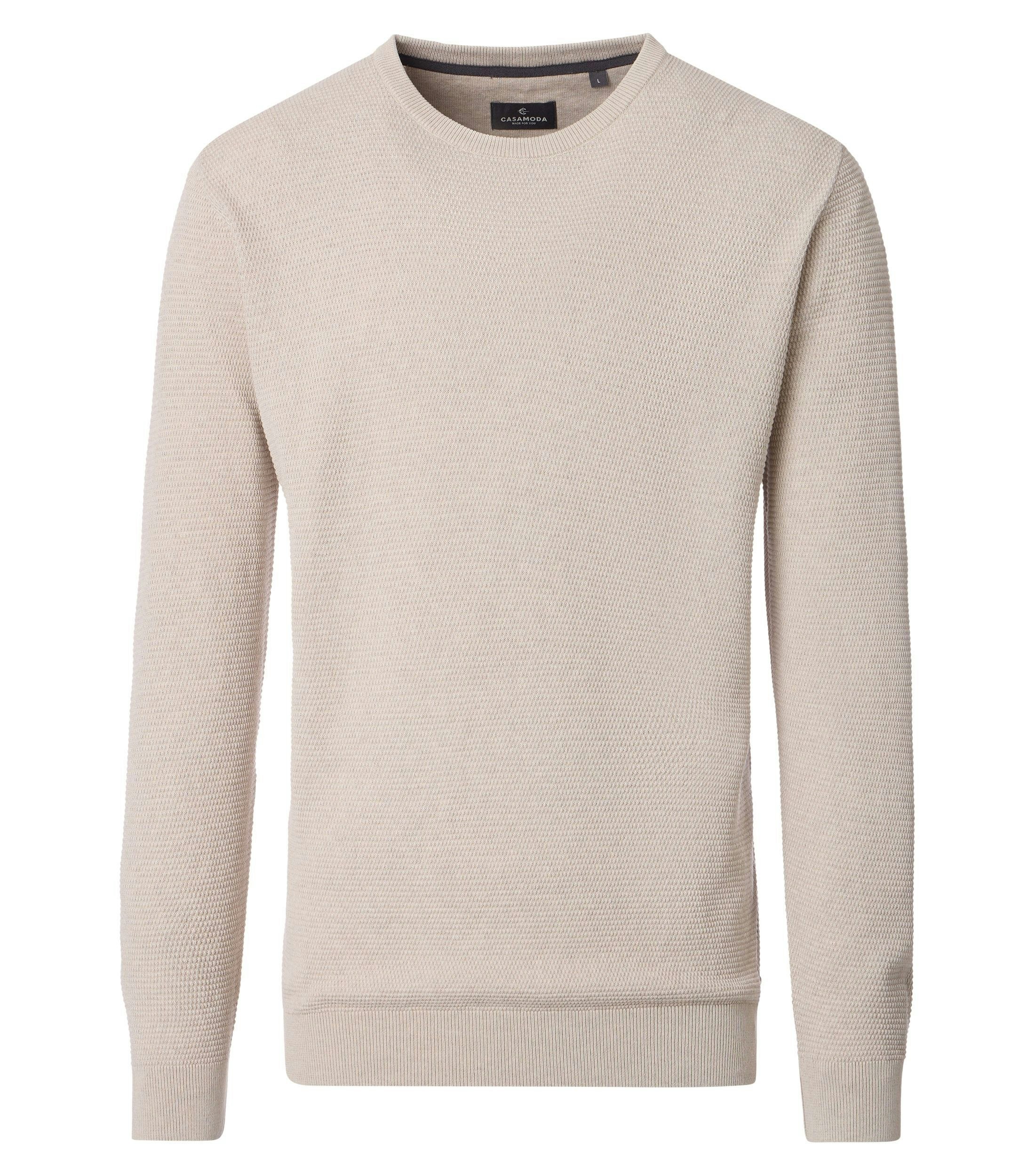 Ein Pullover im uni Muster in der Farbe Weißbeige