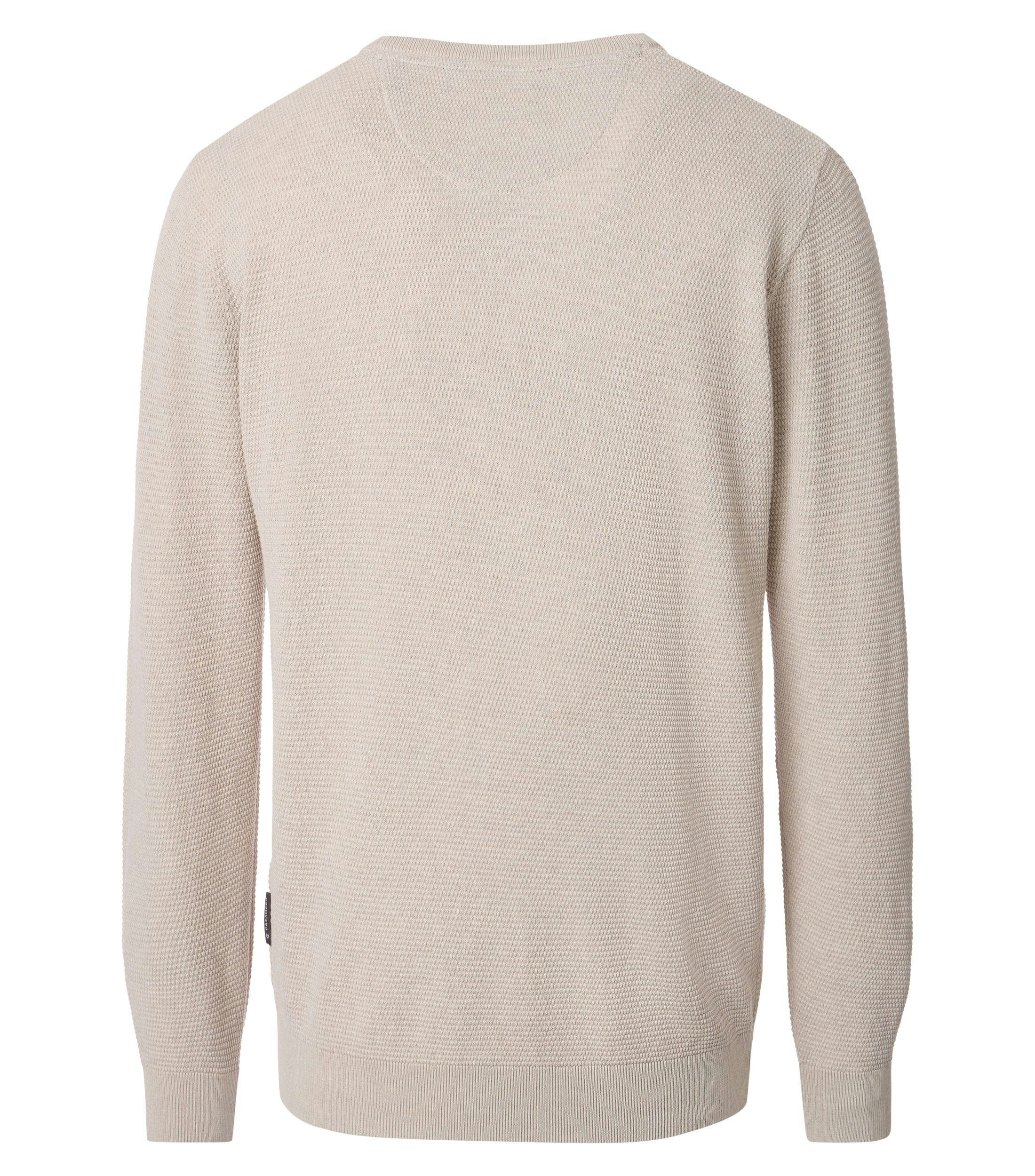 Ein Pullover im uni Muster in der Farbe Weißbeige