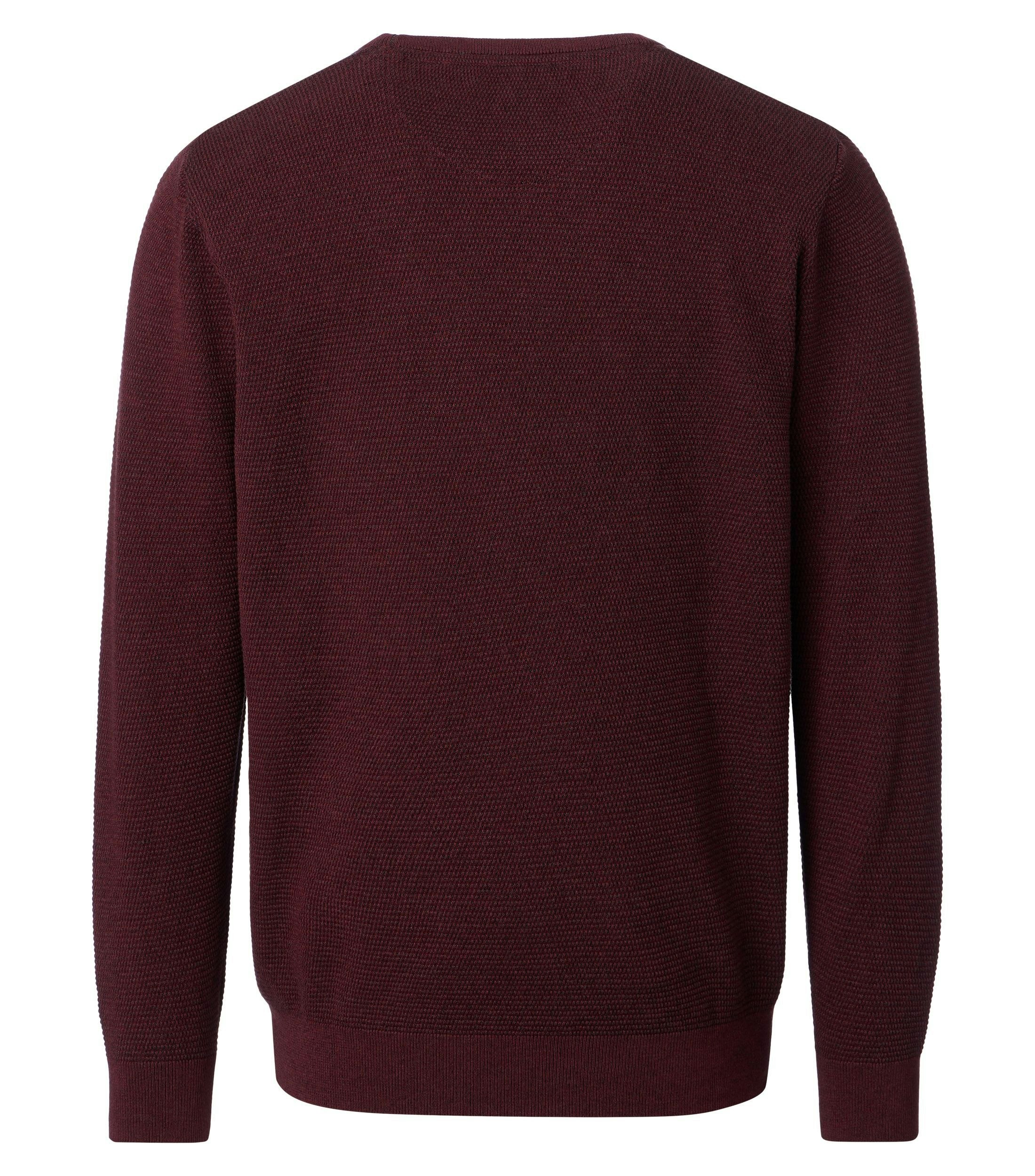 Ein Pullover im uni Muster in der Farbe Rot
