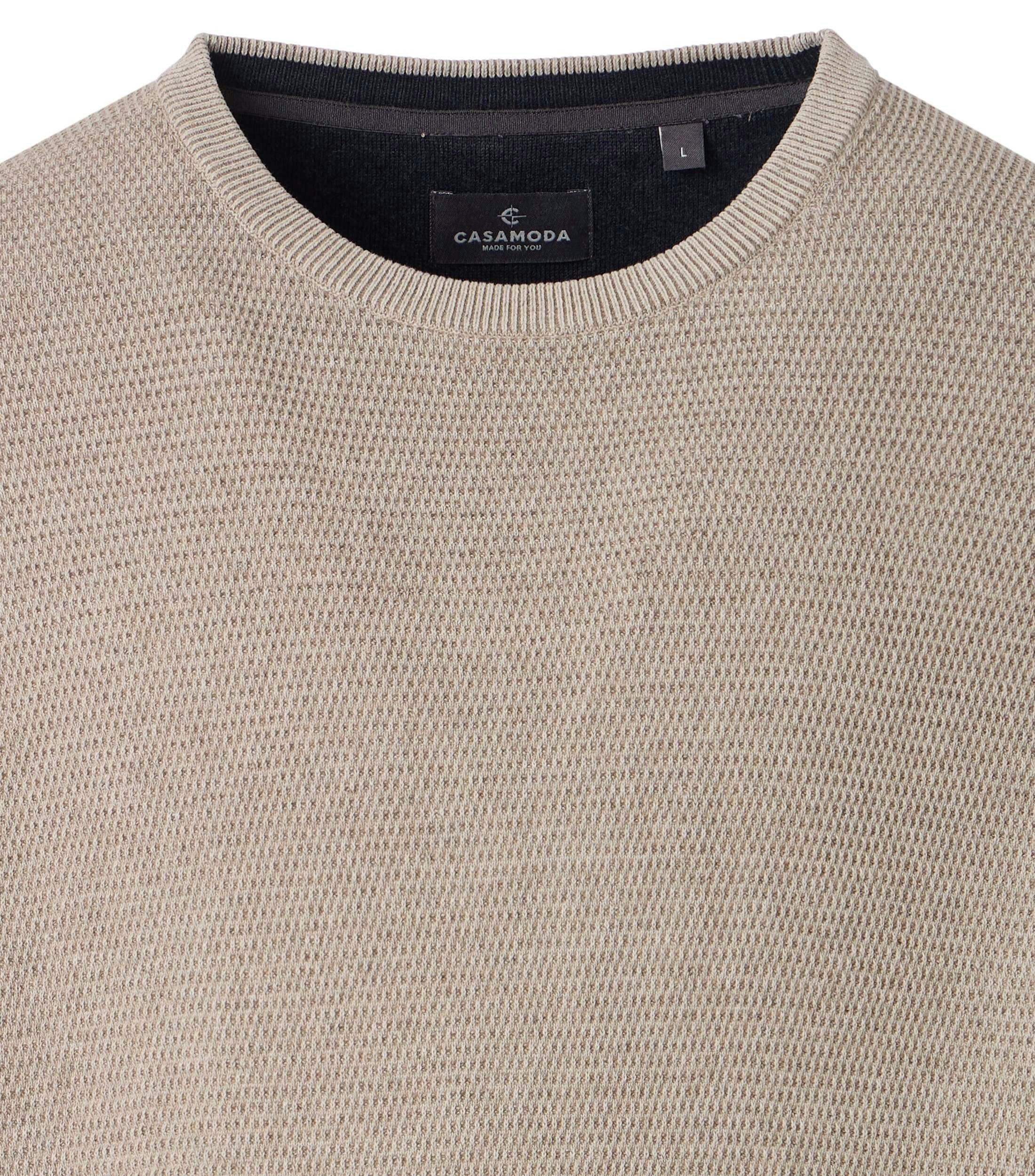 Ein Pullover im uni Muster in der Farbe Beige