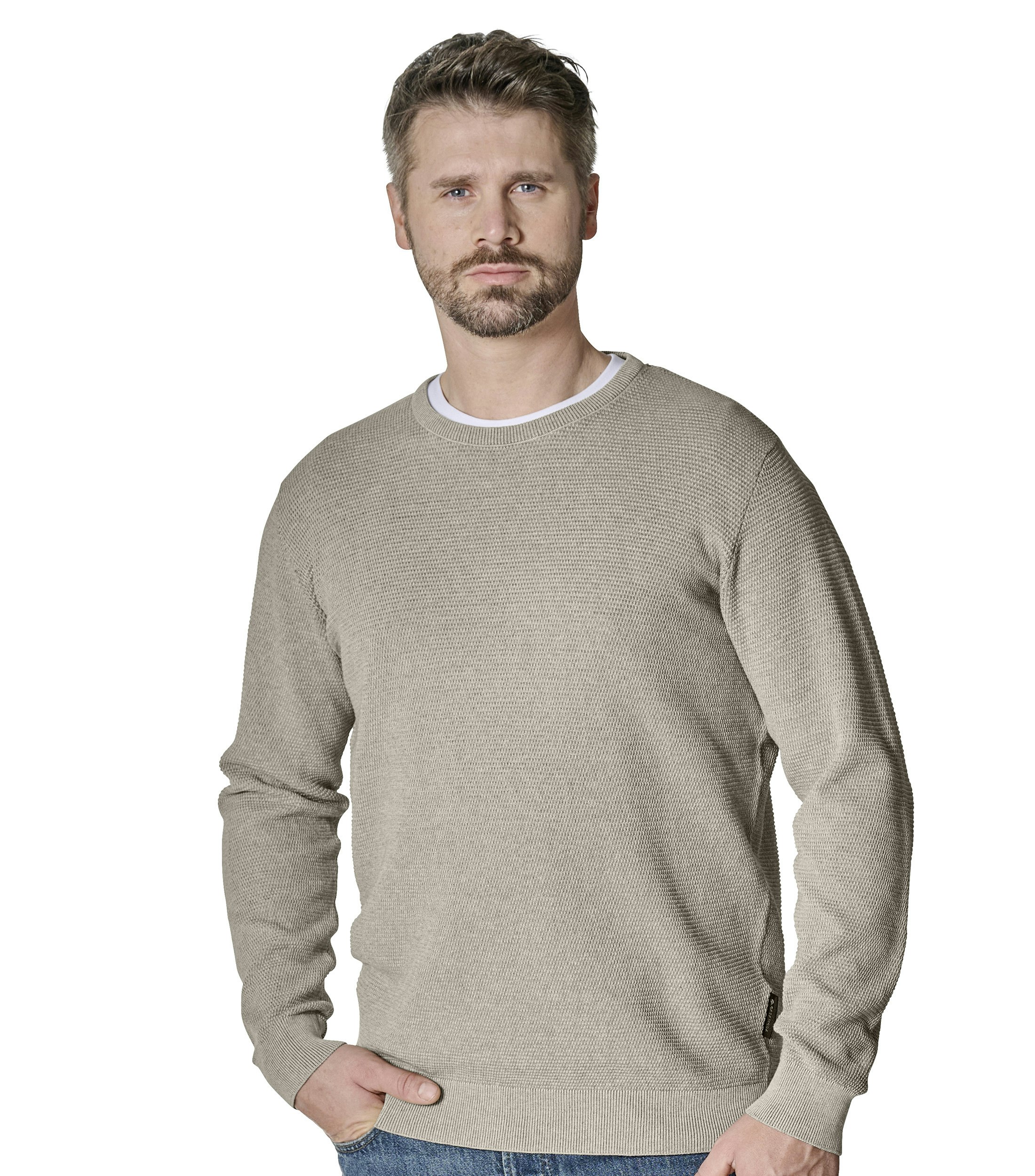 Ein Pullover im uni Muster in der Farbe Beige