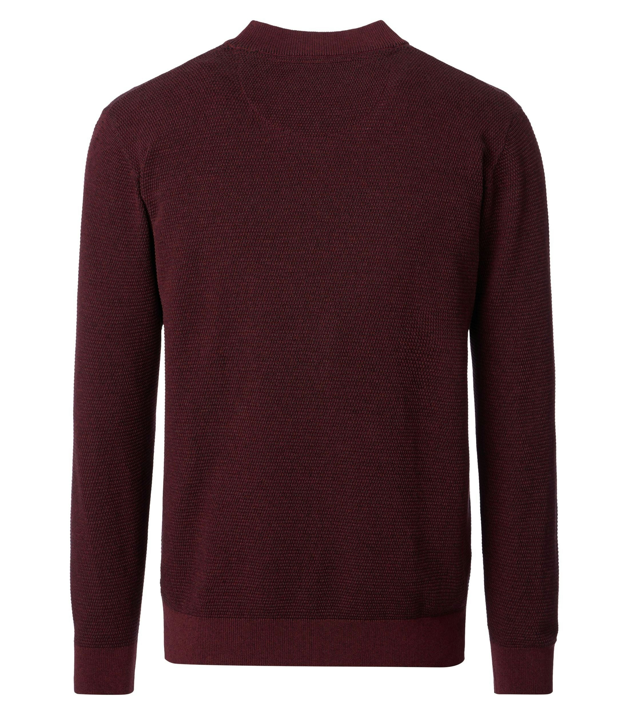 Eine Strickjacke im uni Muster in der Farbe Rot