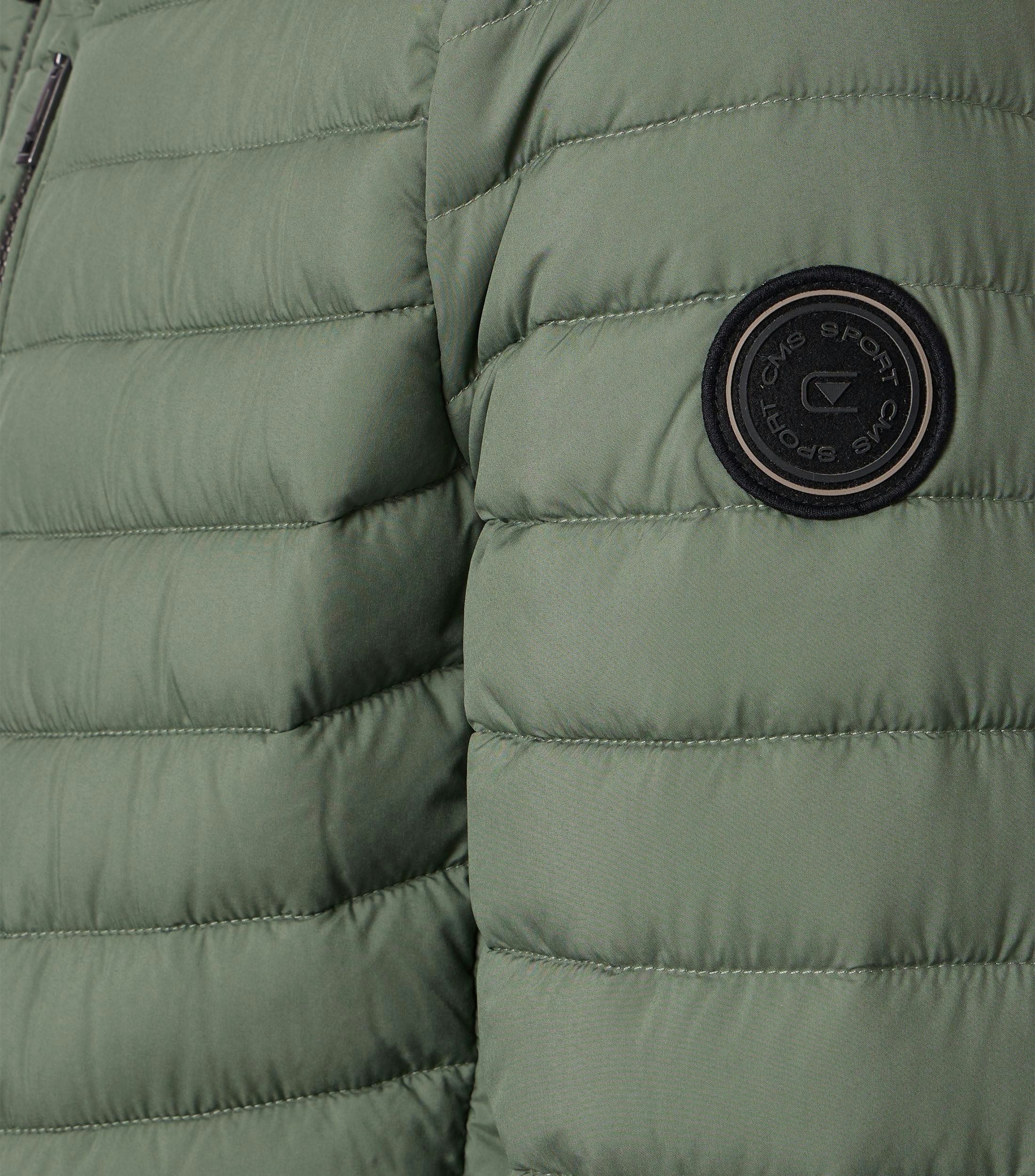 Eine Jacke im uni Muster in der Farbe Türkis