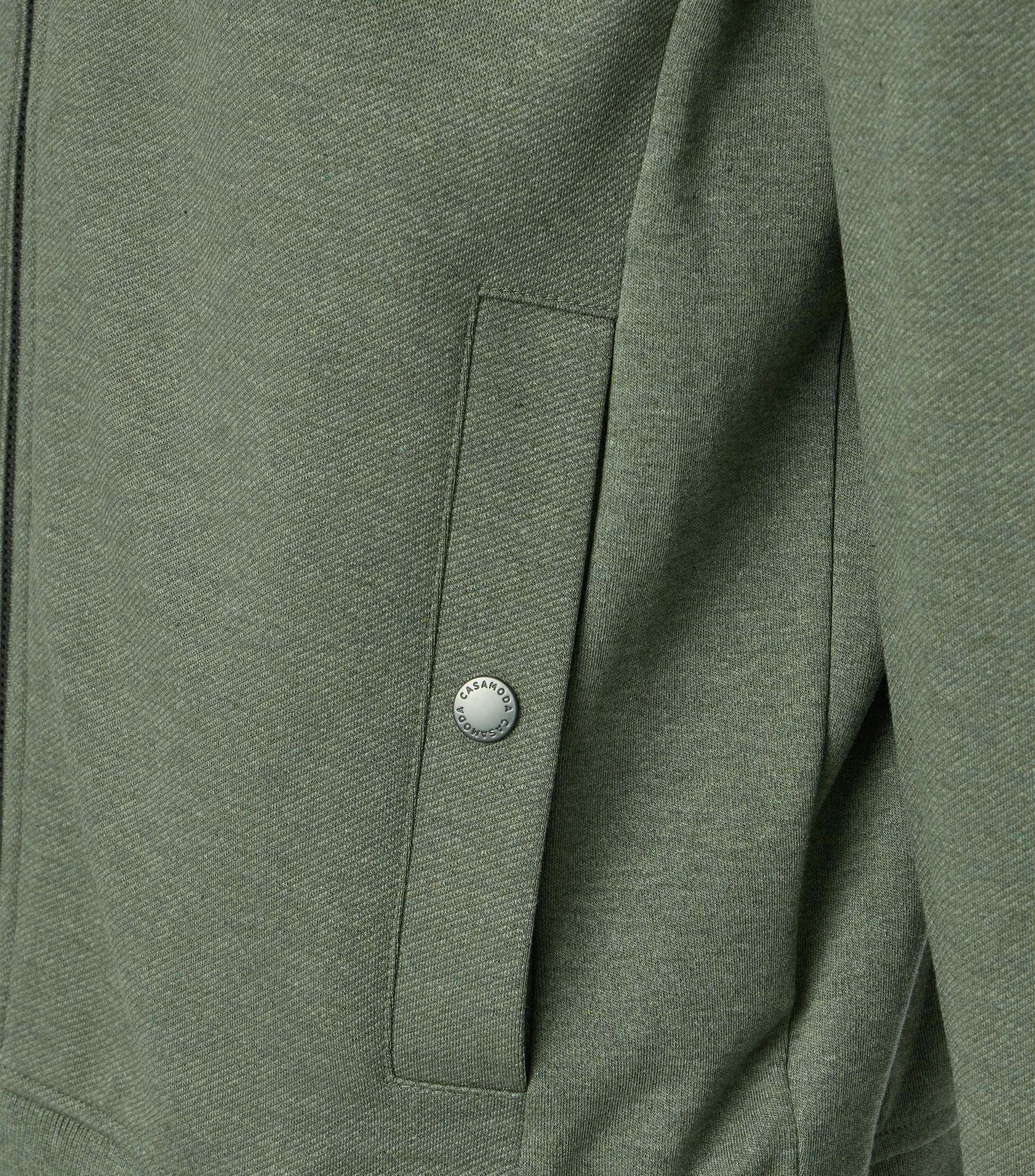 Eine Sweatjacke im uni Muster in der Farbe Grün