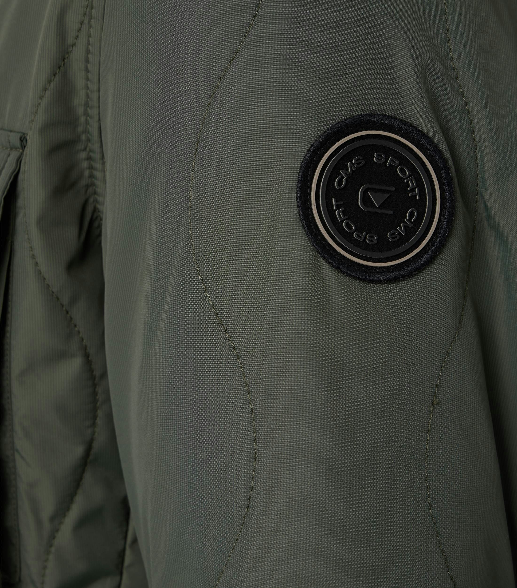 Eine Jacke im uni Muster in der Farbe Grün