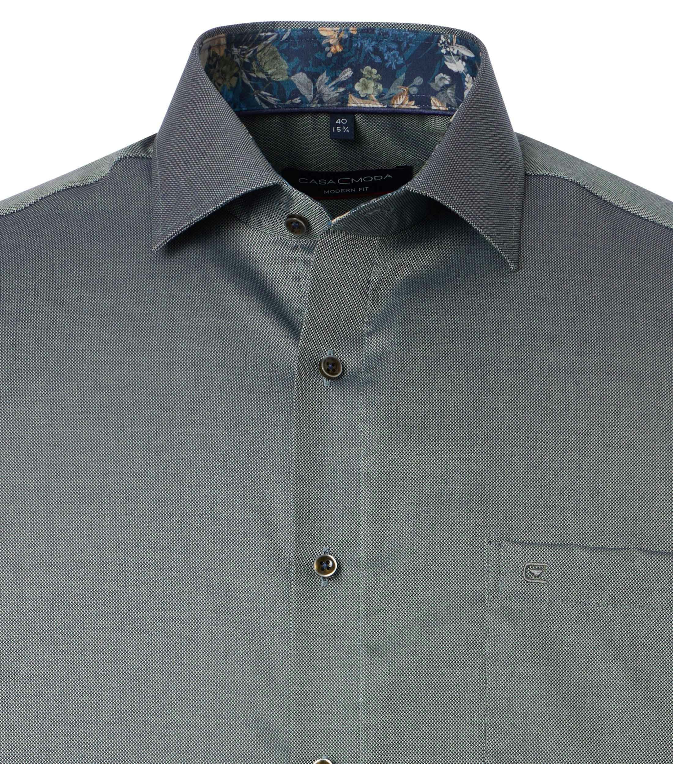 Ein Businesshemd im uni Muster in der Farbe Dunkelgrün