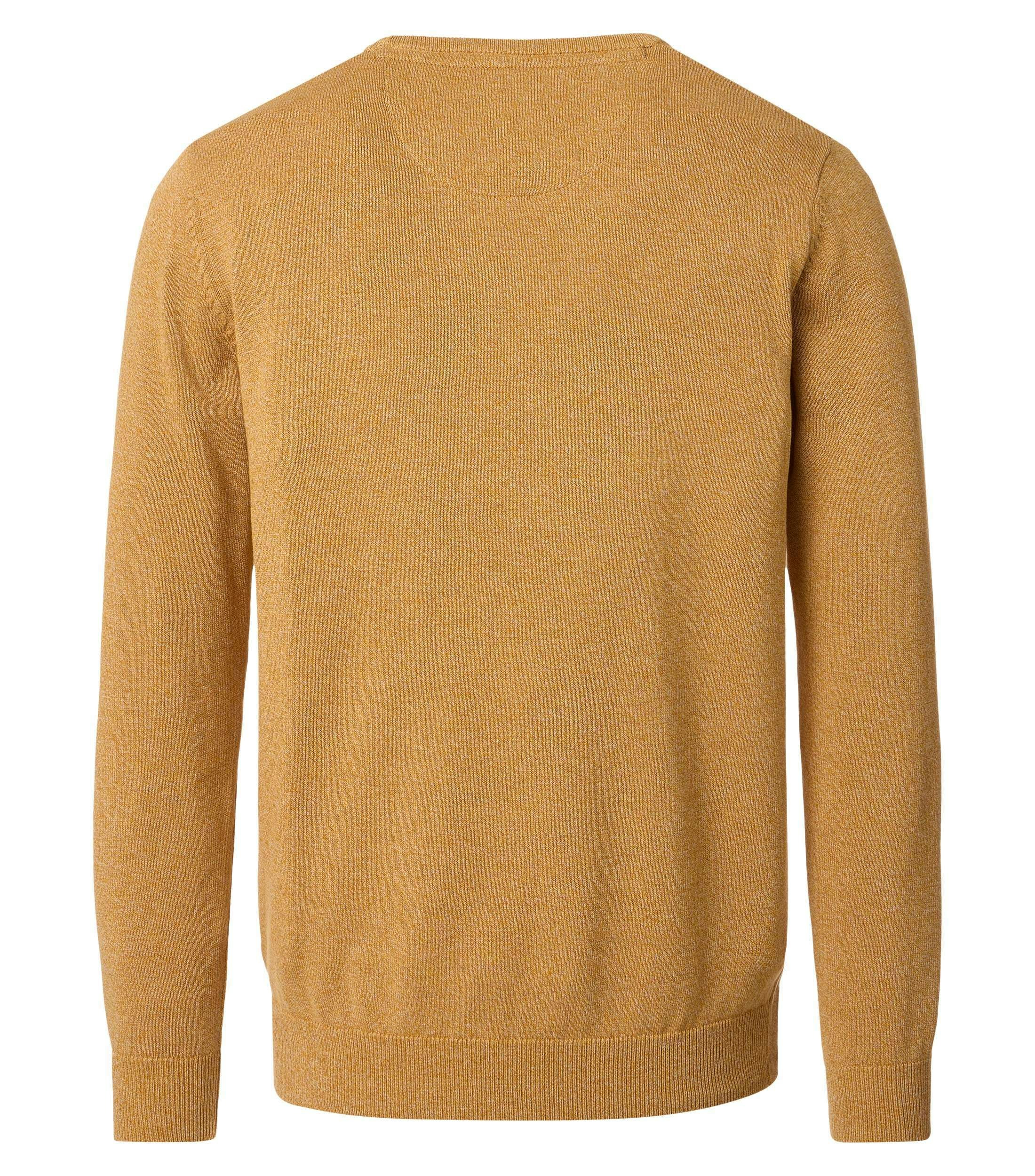 Das Model trägt ein Pullover im uni Muster in der Farbe Gelb