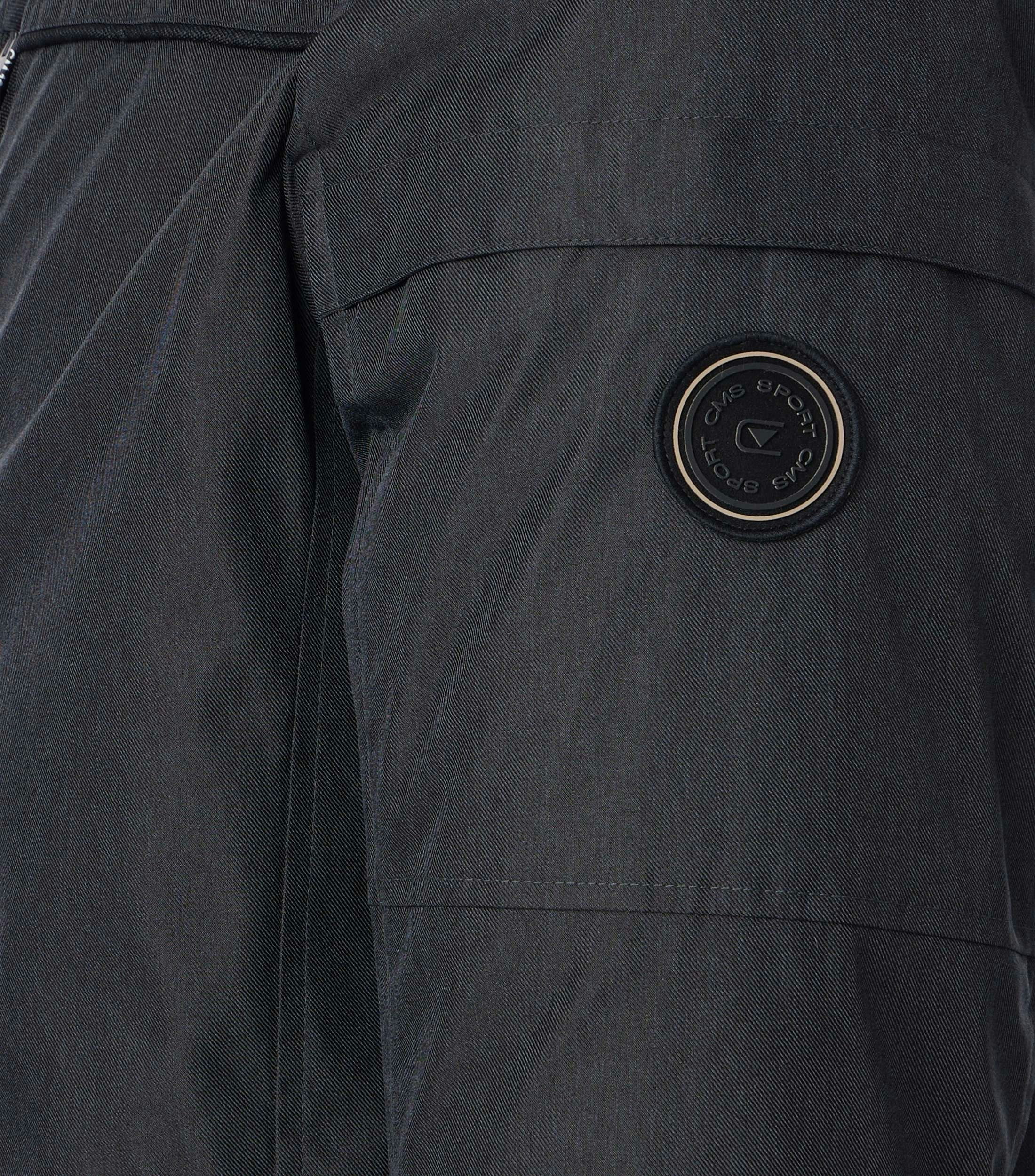 Eine Jacke im uni Muster in der Farbe Grauschwarz