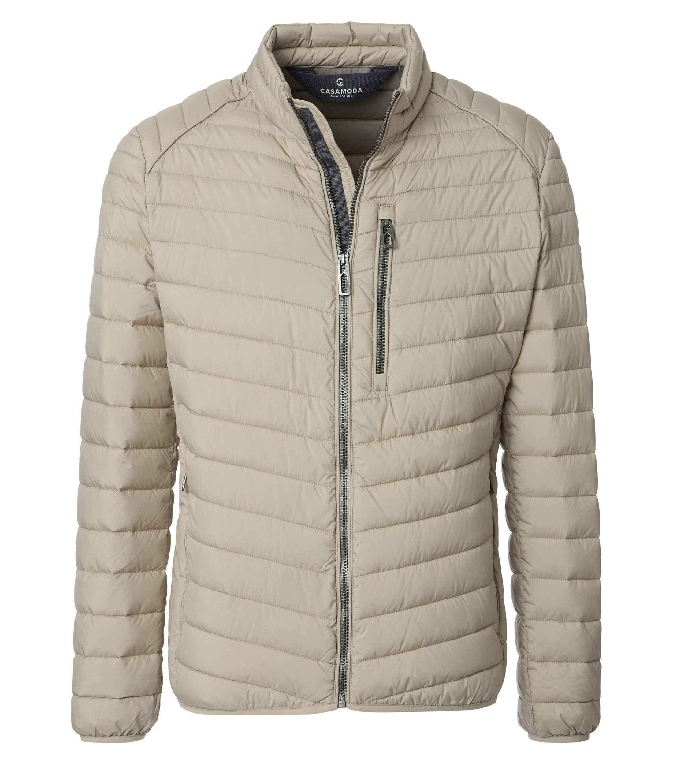 Eine Jacke im uni Muster in der Farbe Beige