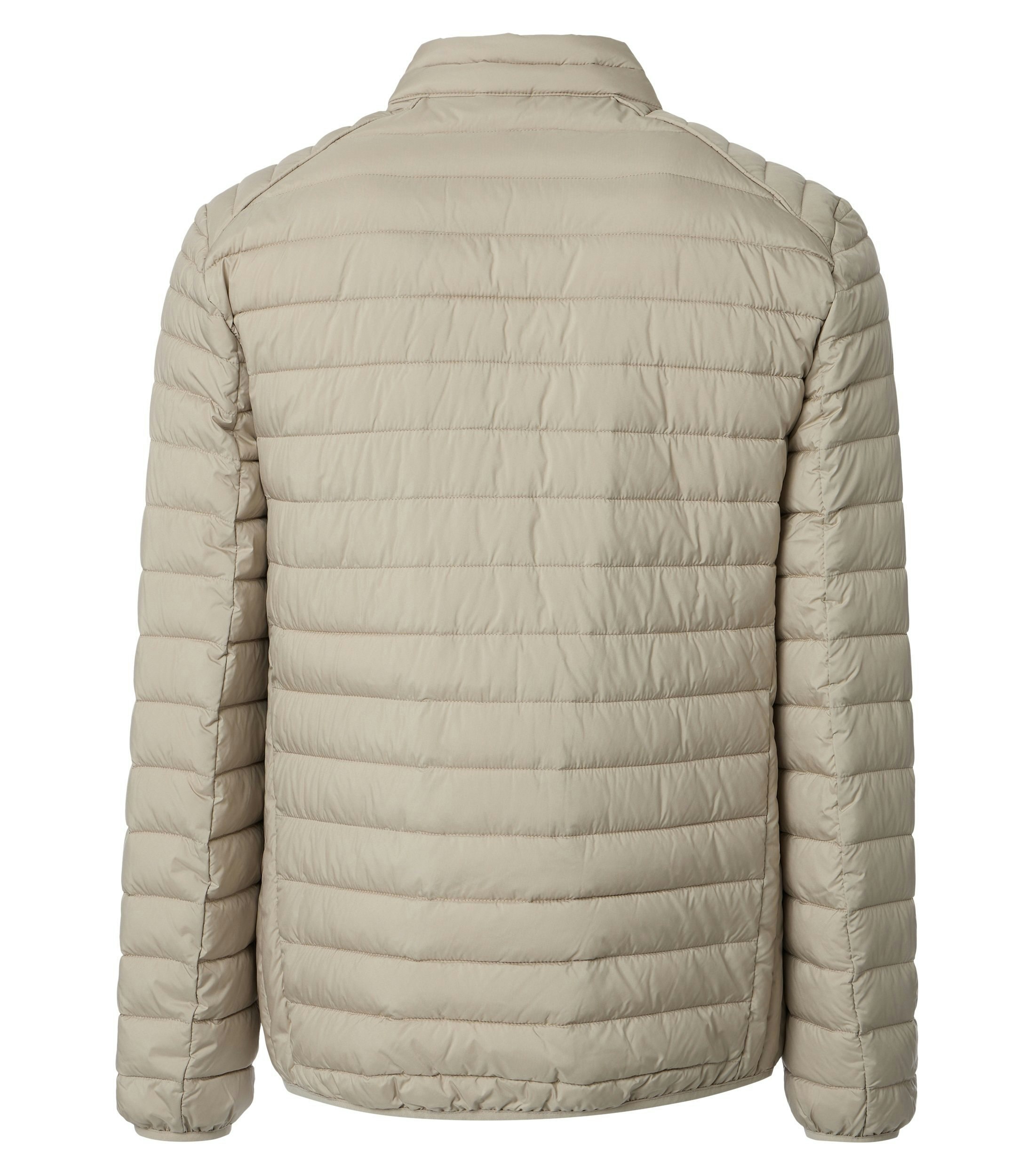 Eine Jacke im uni Muster in der Farbe Beige