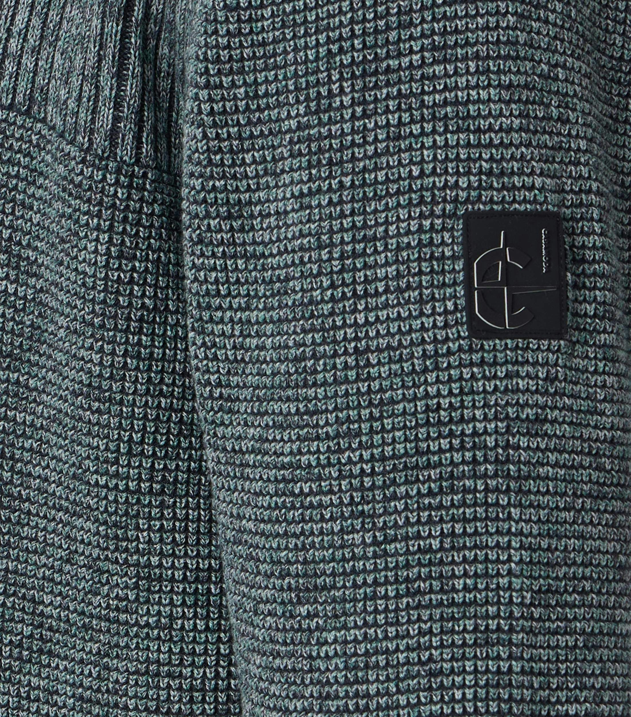 Ein Pullover im uni Muster in der Farbe Dunkelgrün