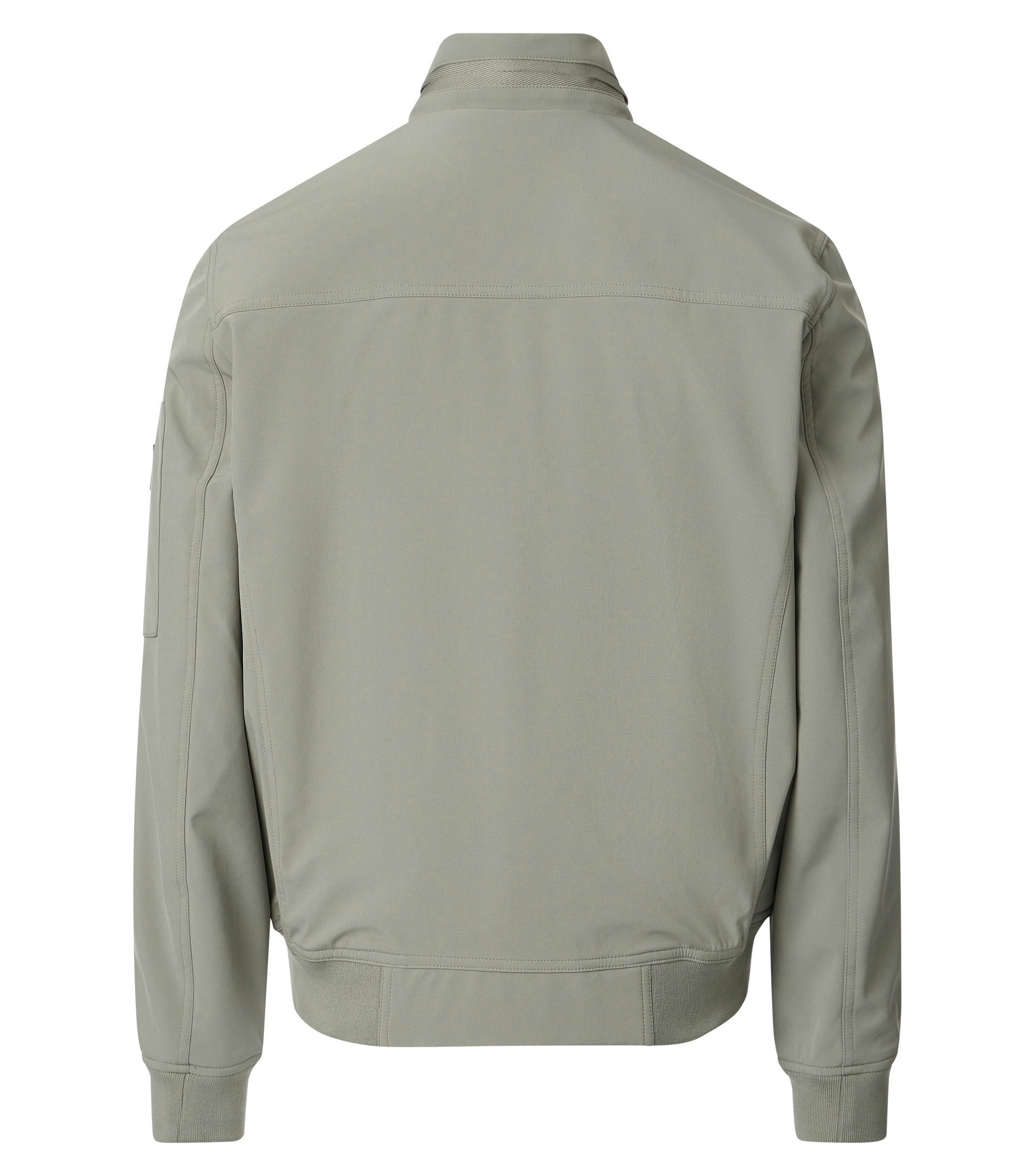 Eine Jacke im uni Muster in der Farbe Grün