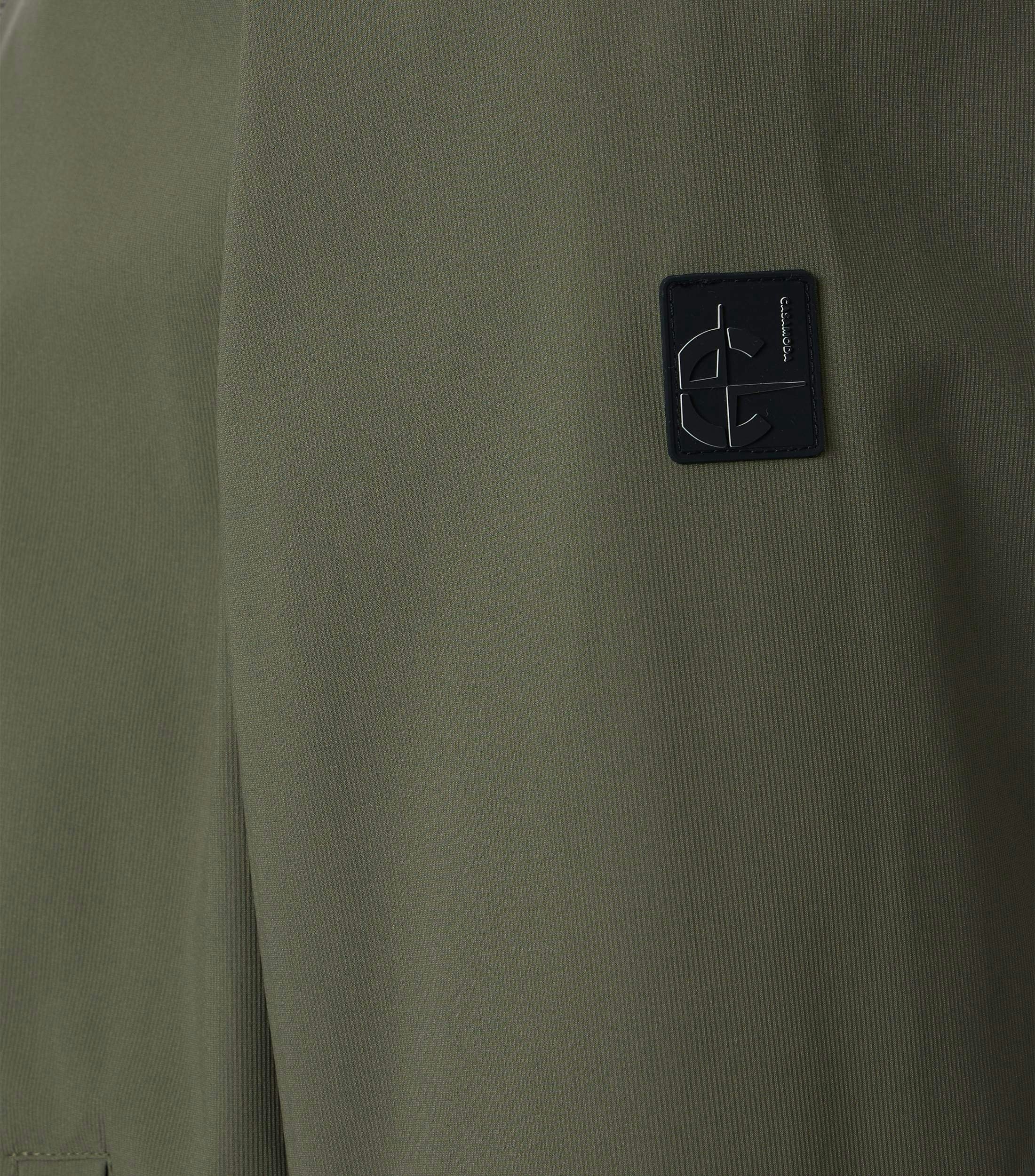 Eine Jacke im uni Muster in der Farbe Olive