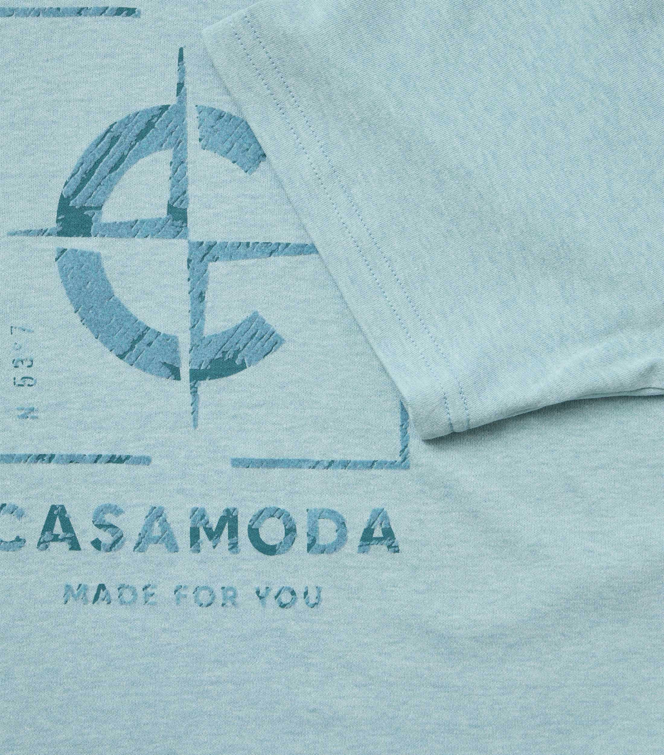 Ein T-Shirt im uni Muster in der Farbe Türkis