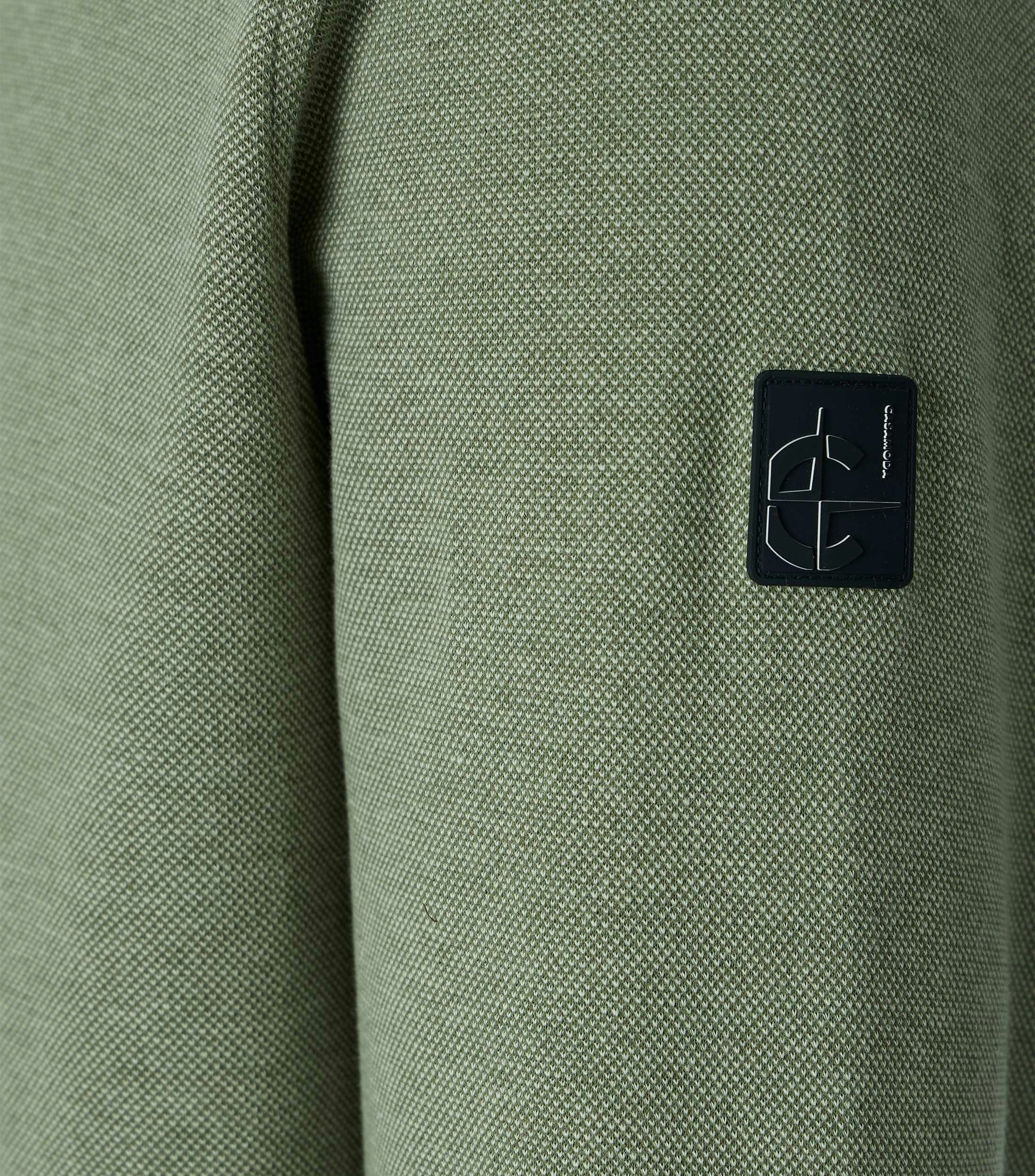 Eine Sweatjacke im uni Muster in der Farbe Grün