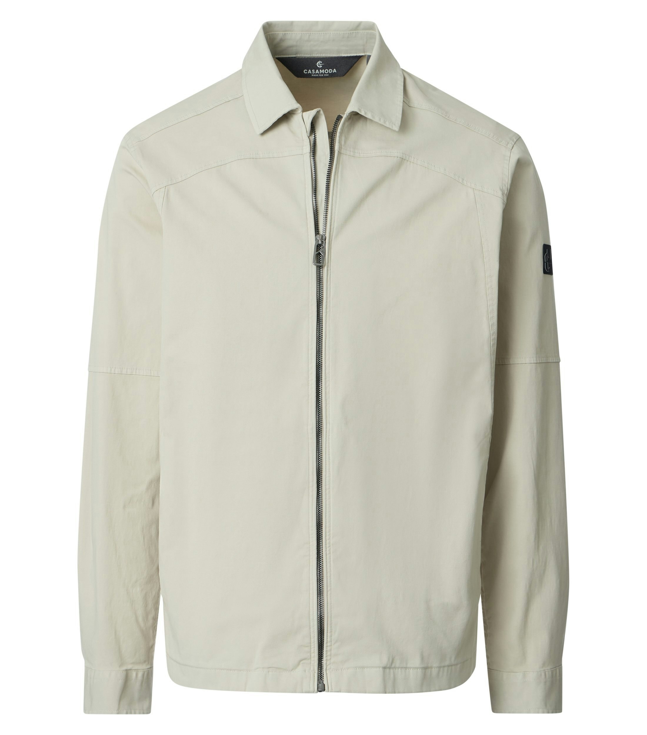 Eine Jacke im uni Muster in der Farbe Beige