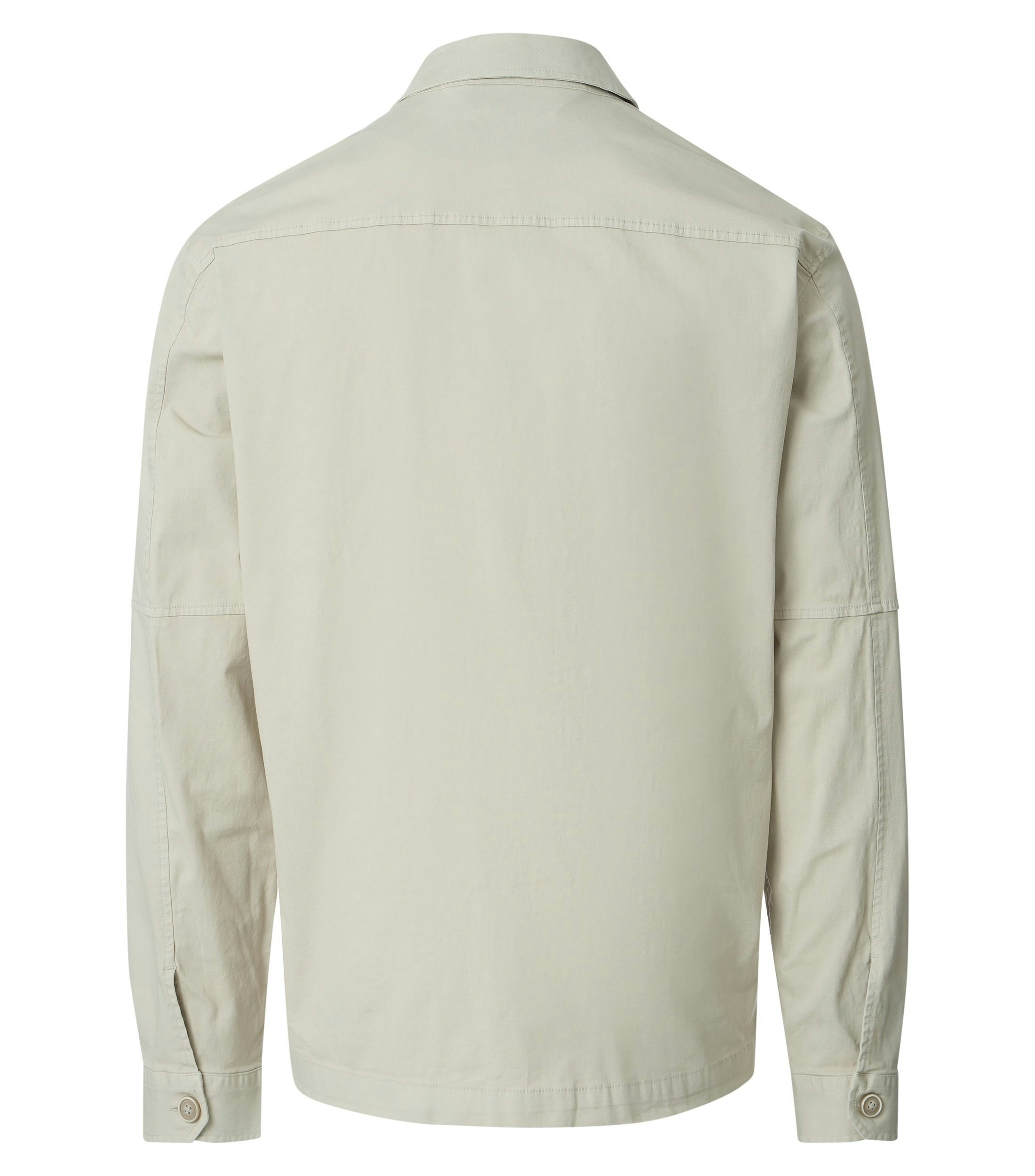 Eine Jacke im uni Muster in der Farbe Beige