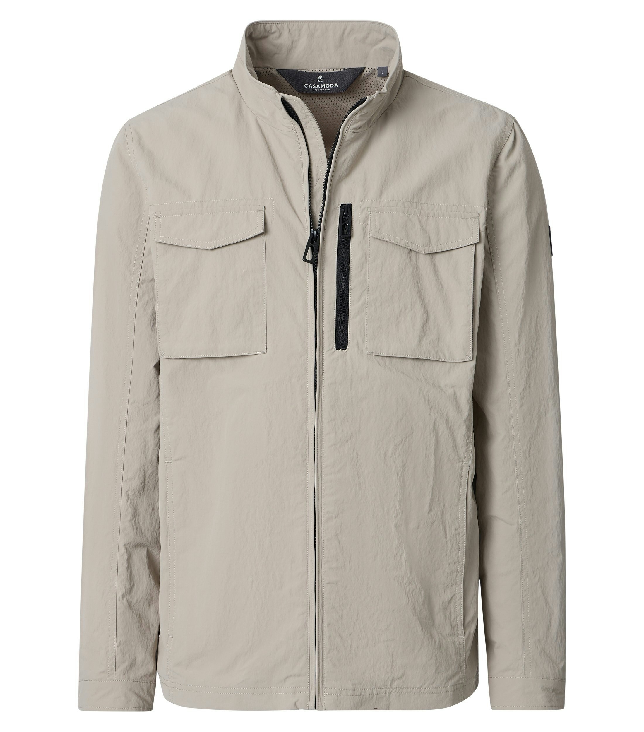 Eine Jacke im uni Muster in der Farbe Beige