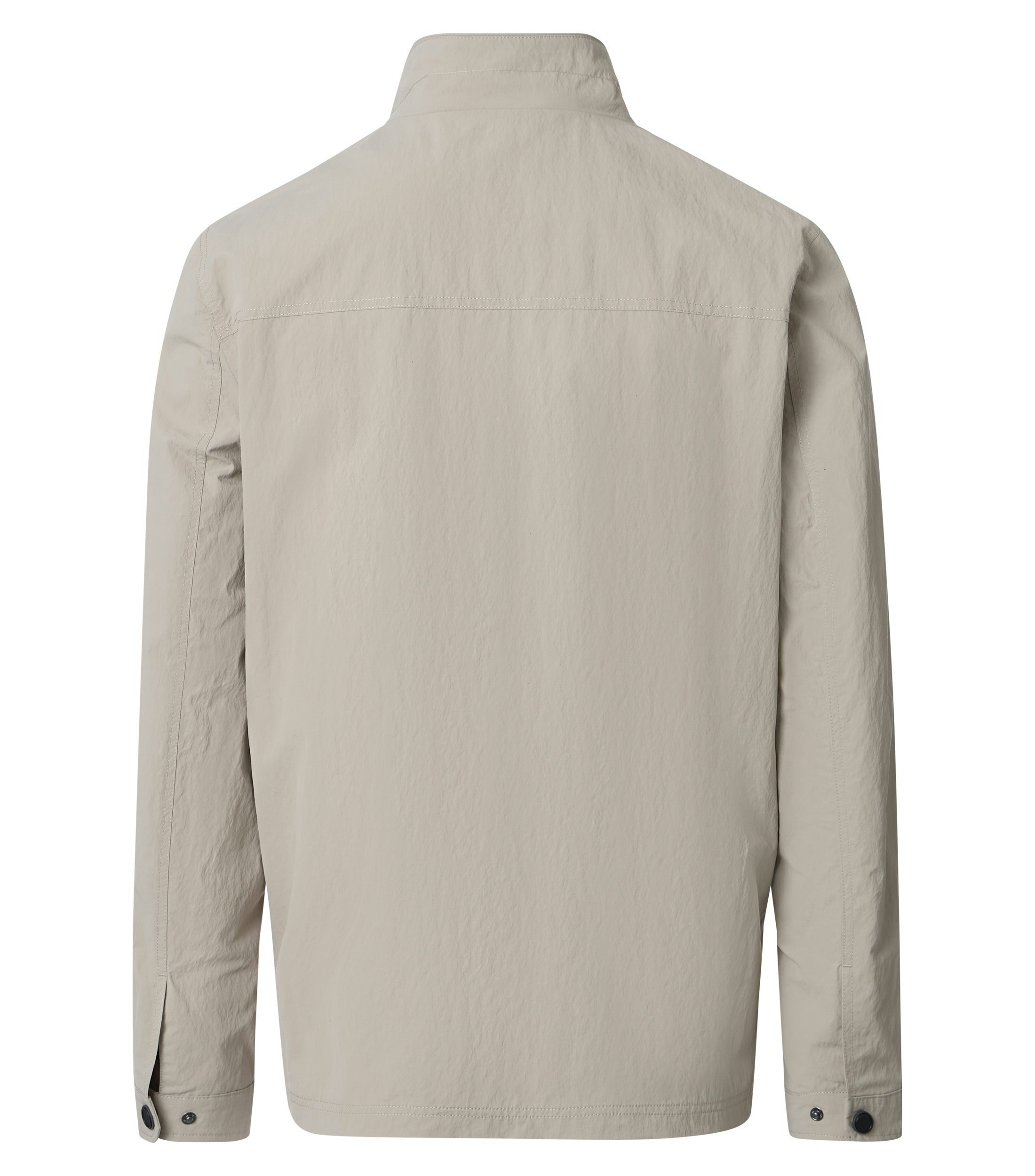 Eine Jacke im uni Muster in der Farbe Beige