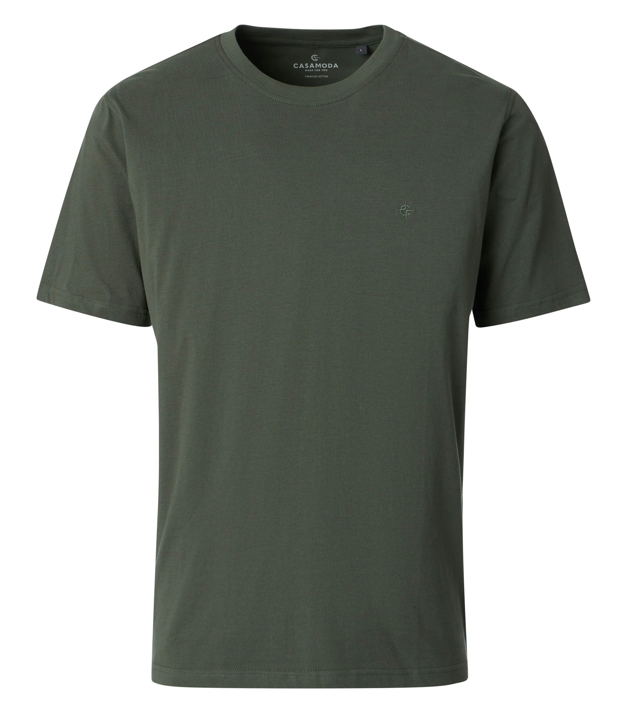 Das Model trägt ein TShirt im uni Muster in der Farbe Olive
