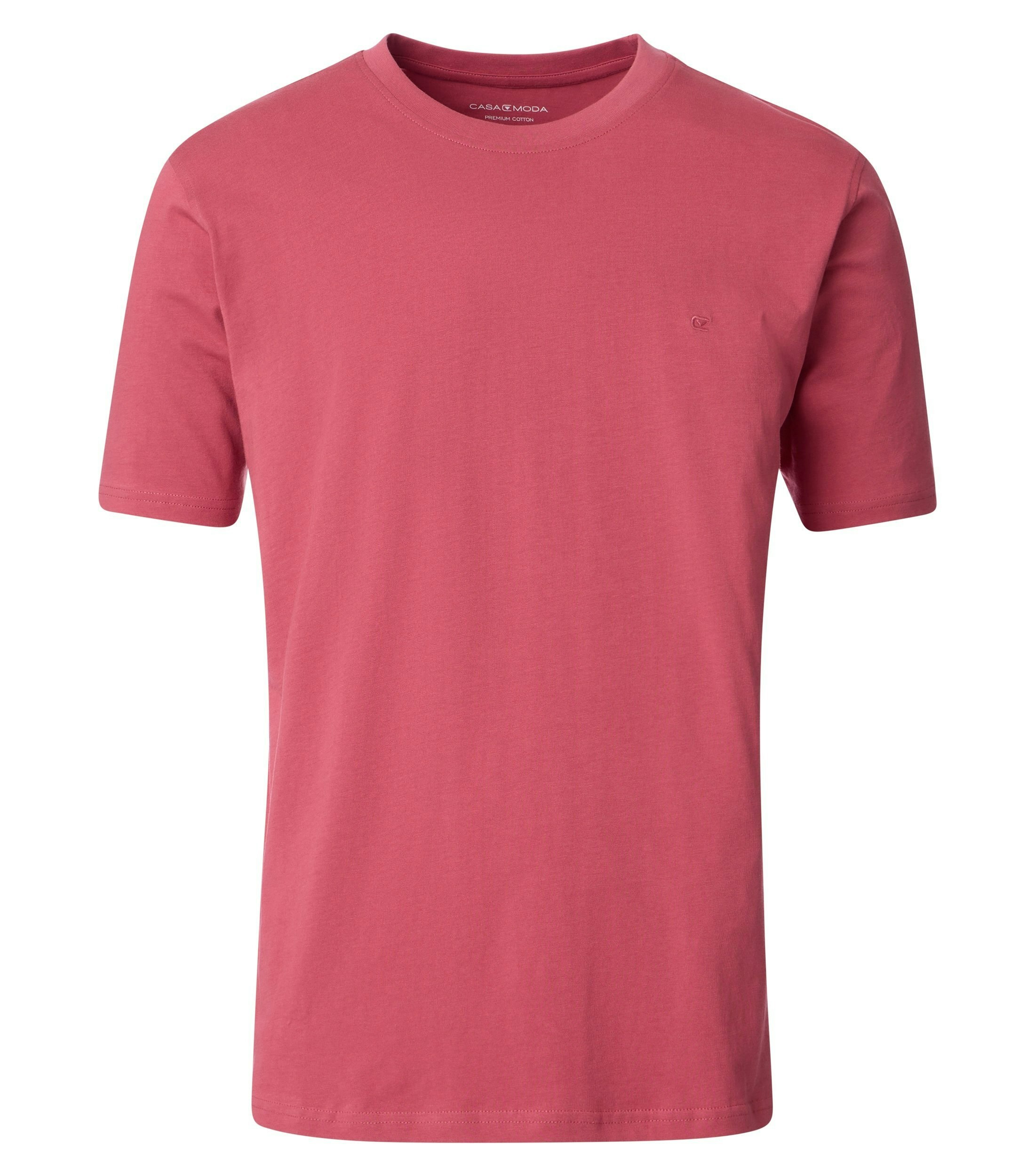 Das Model trägt ein TShirt im uni Muster in der Farbe Hellrot