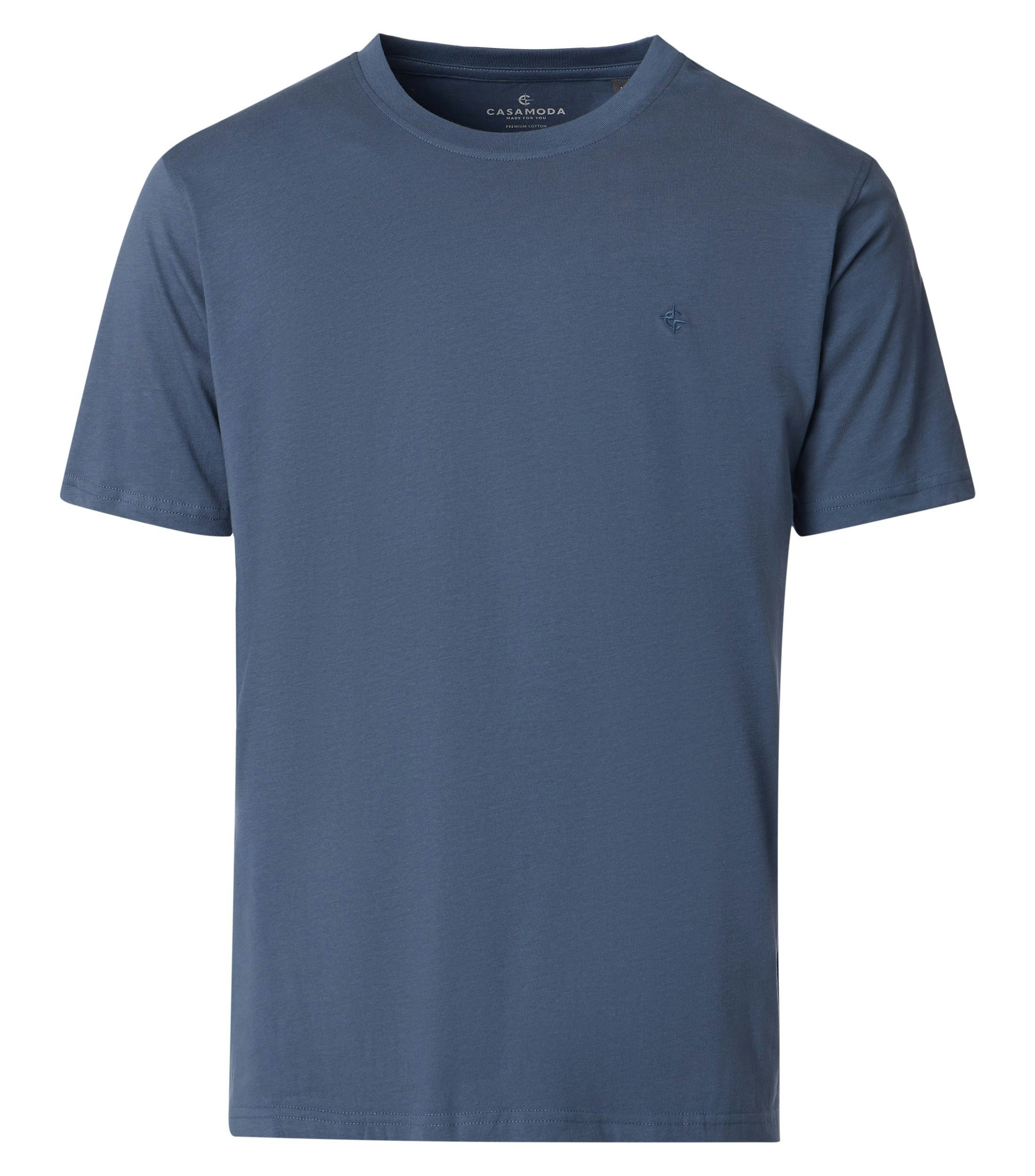 Das Model trägt ein TShirt im uni Muster in der Farbe Aquadunkelblau