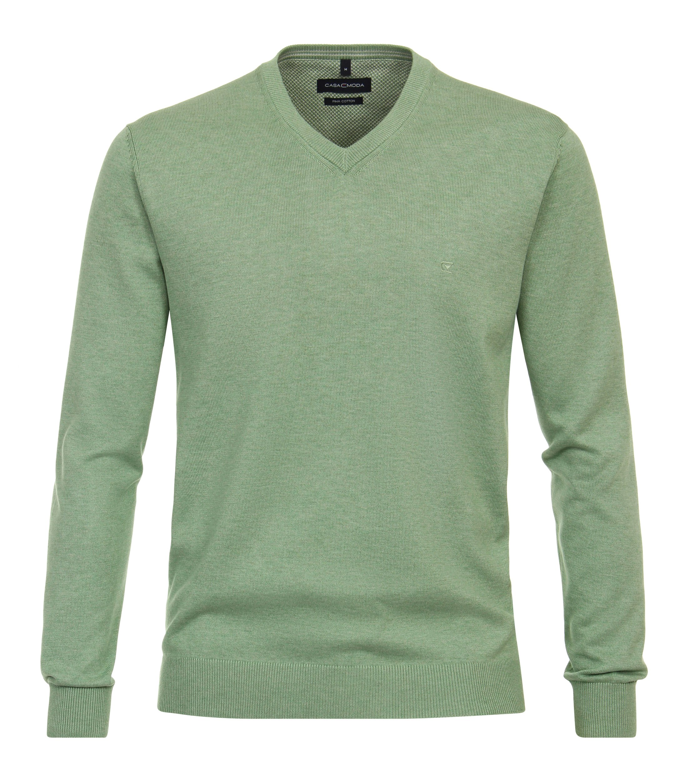 Das Model trägt ein Pullover im uni Muster in der Farbe Grün
