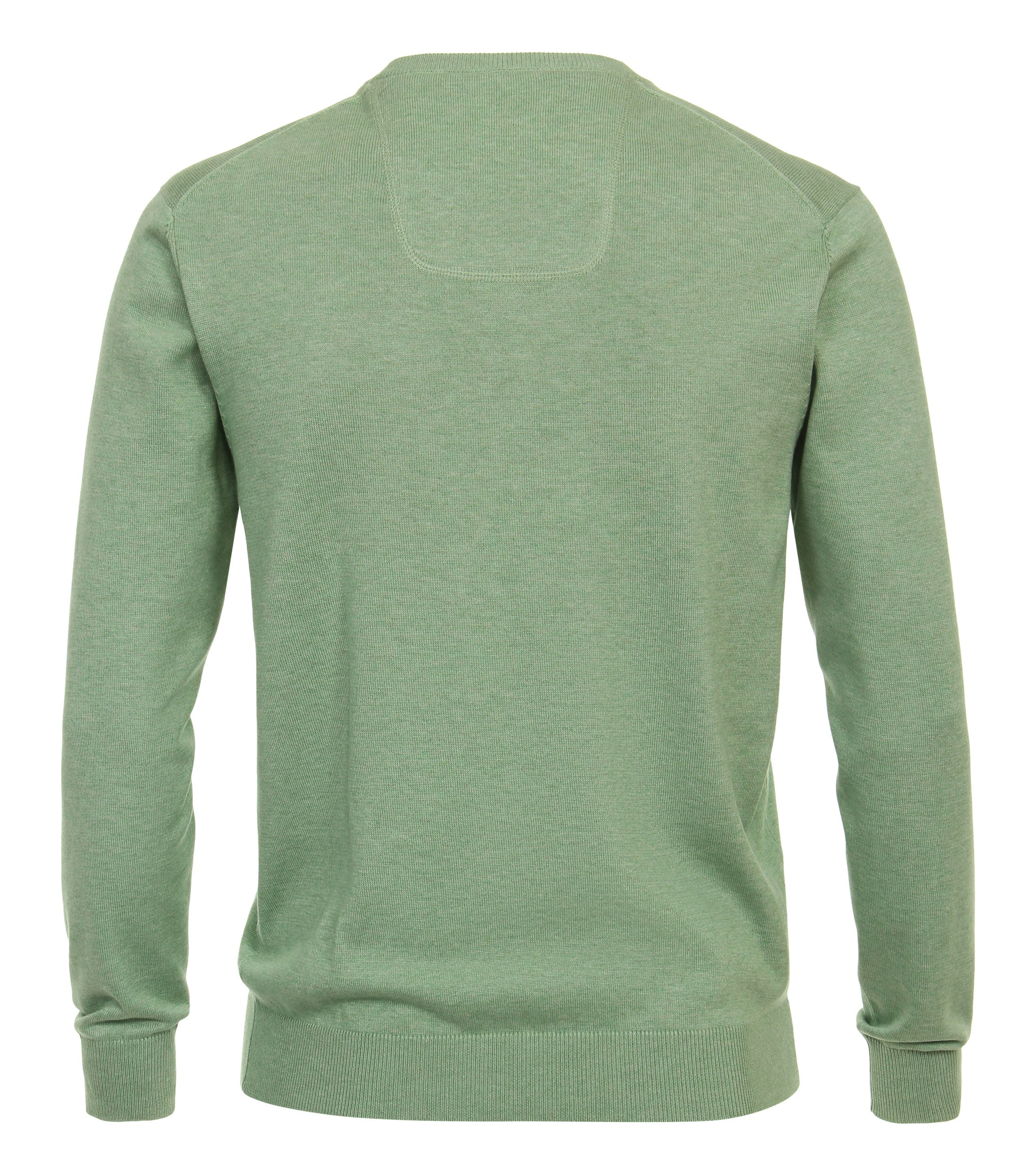 Das Model trägt ein Pullover im uni Muster in der Farbe Grün