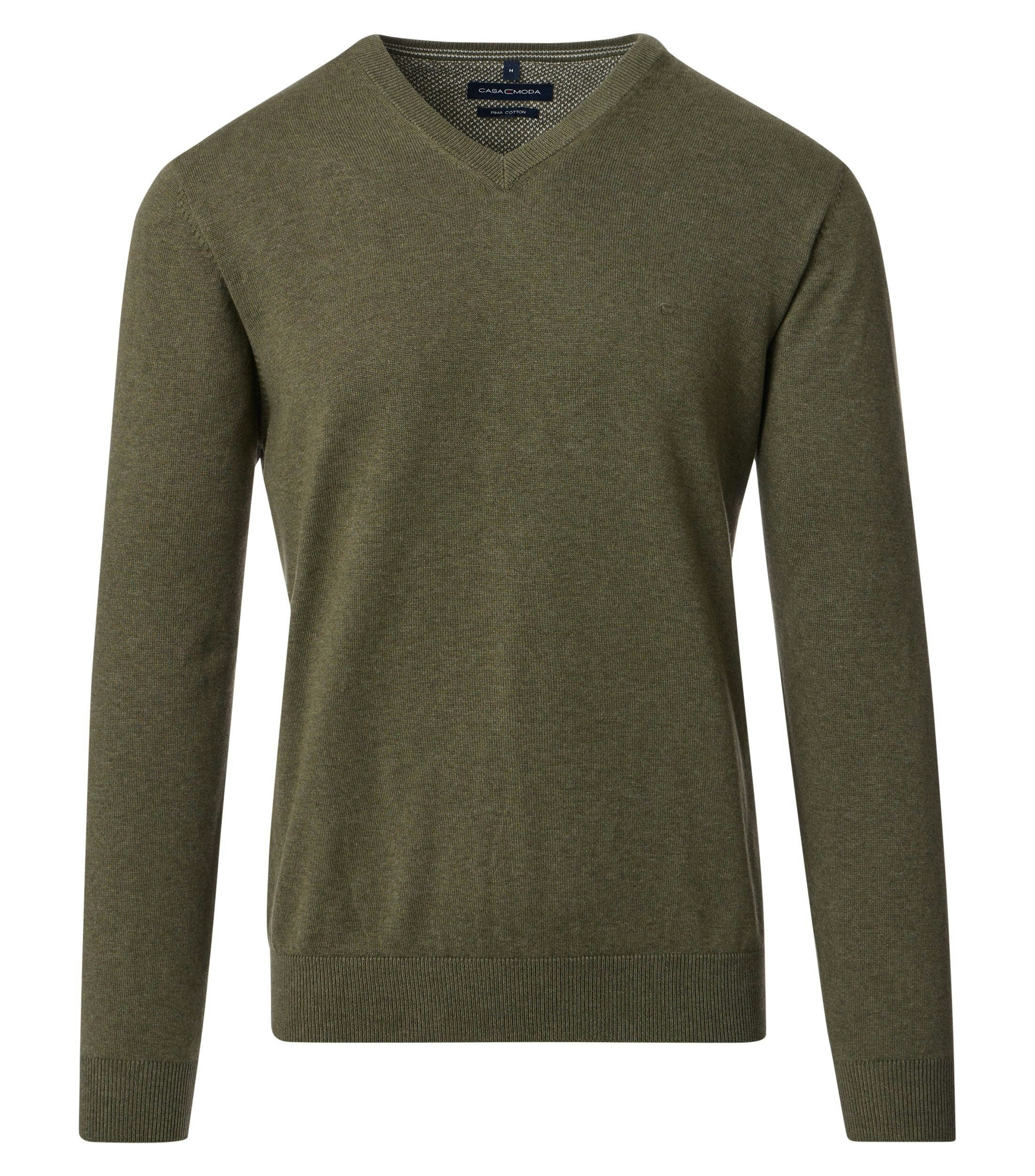 Das Model trägt ein Pullover im uni Muster in der Farbe dunkles Türkis