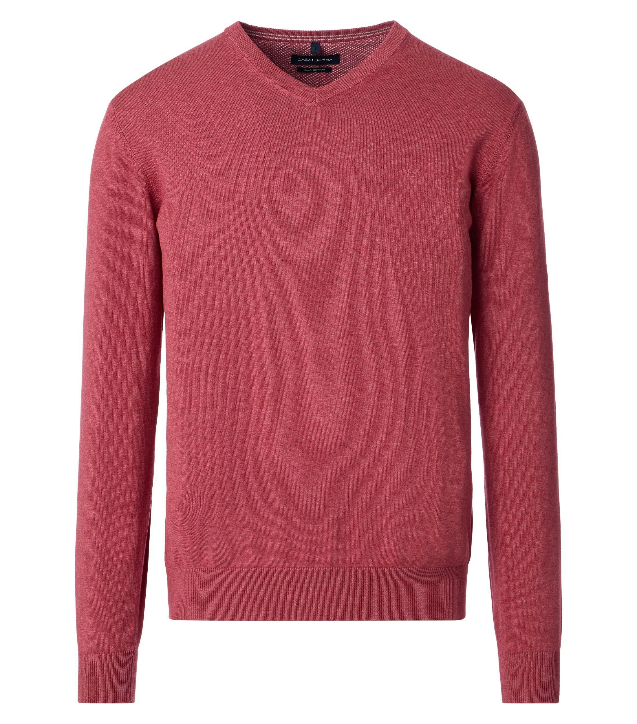 Das Model trägt ein Pullover im uni Muster in der Farbe Hellrot