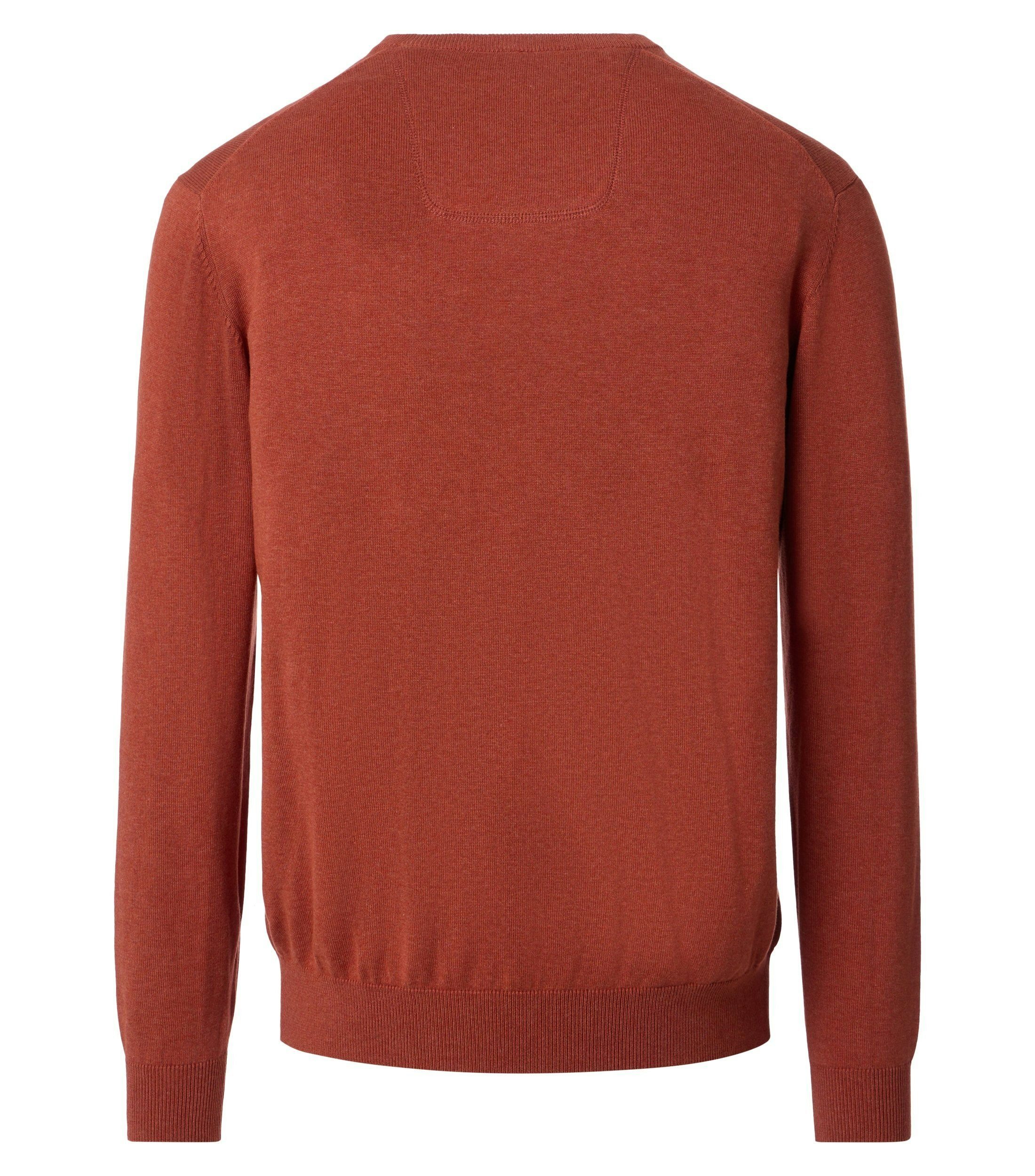 Das Model trägt ein Pullover im uni Muster in der Farbe Orange