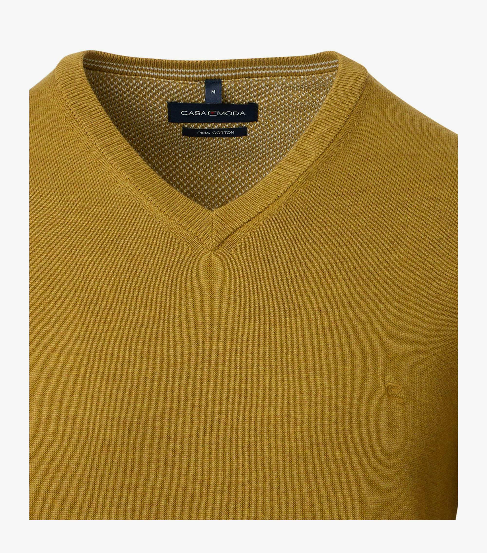 Das Model trägt ein Pullover im uni Muster in der Farbe Gelb