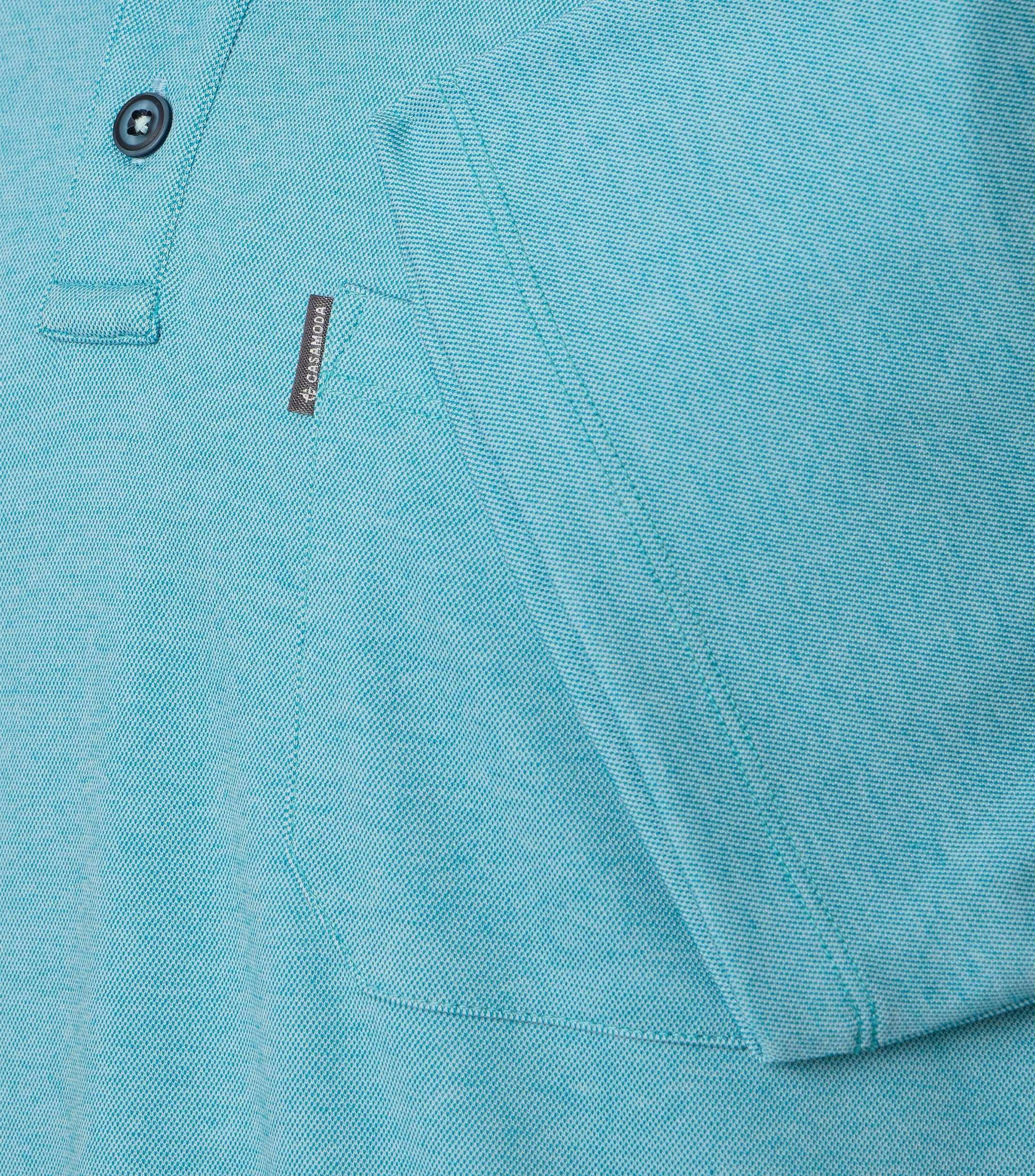 Ein Polo-Shirt im uni Muster in der Farbe Türkis
