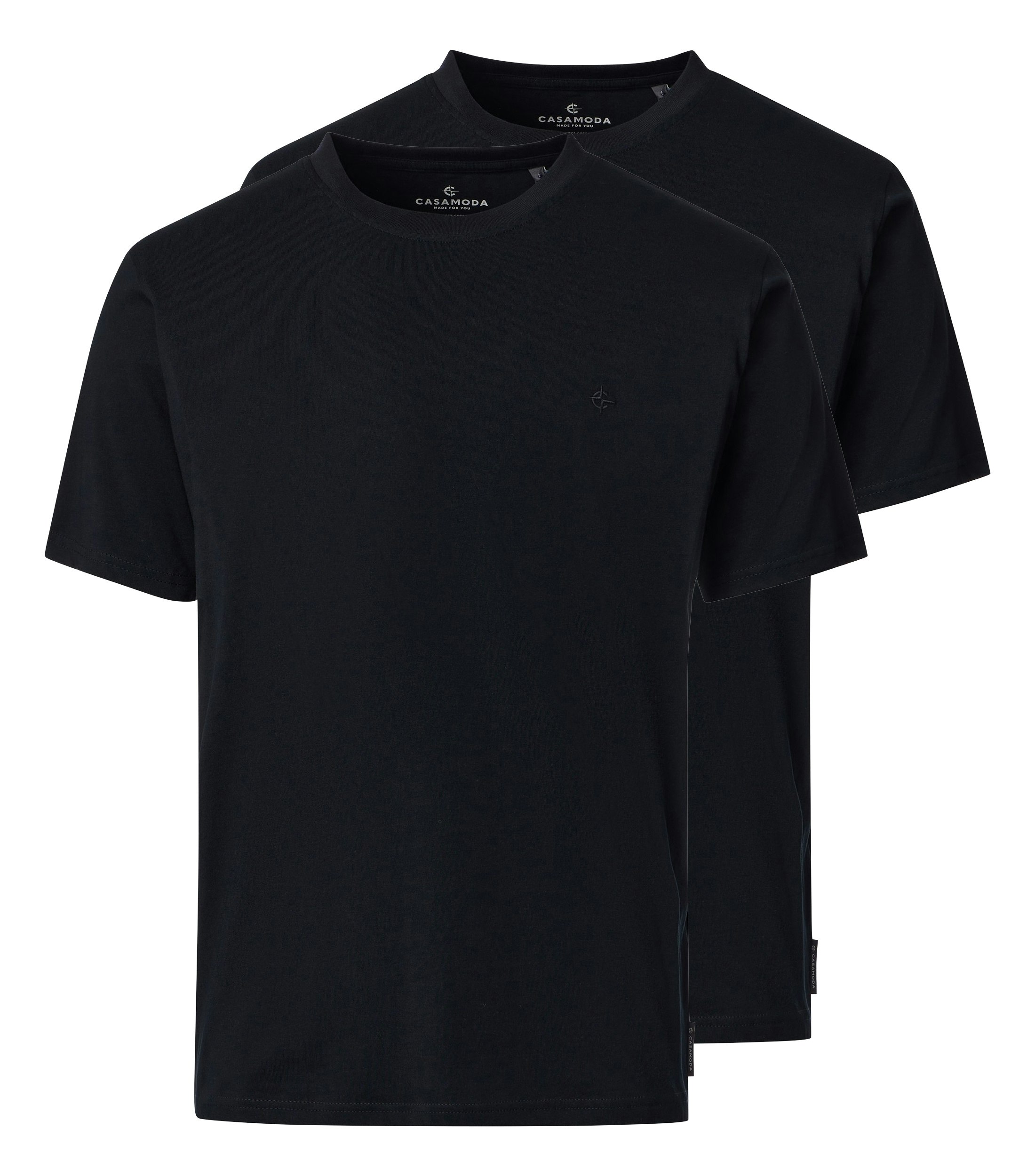 Das Model trägt ein TShirt im uni Muster in der Farbe Schwarz